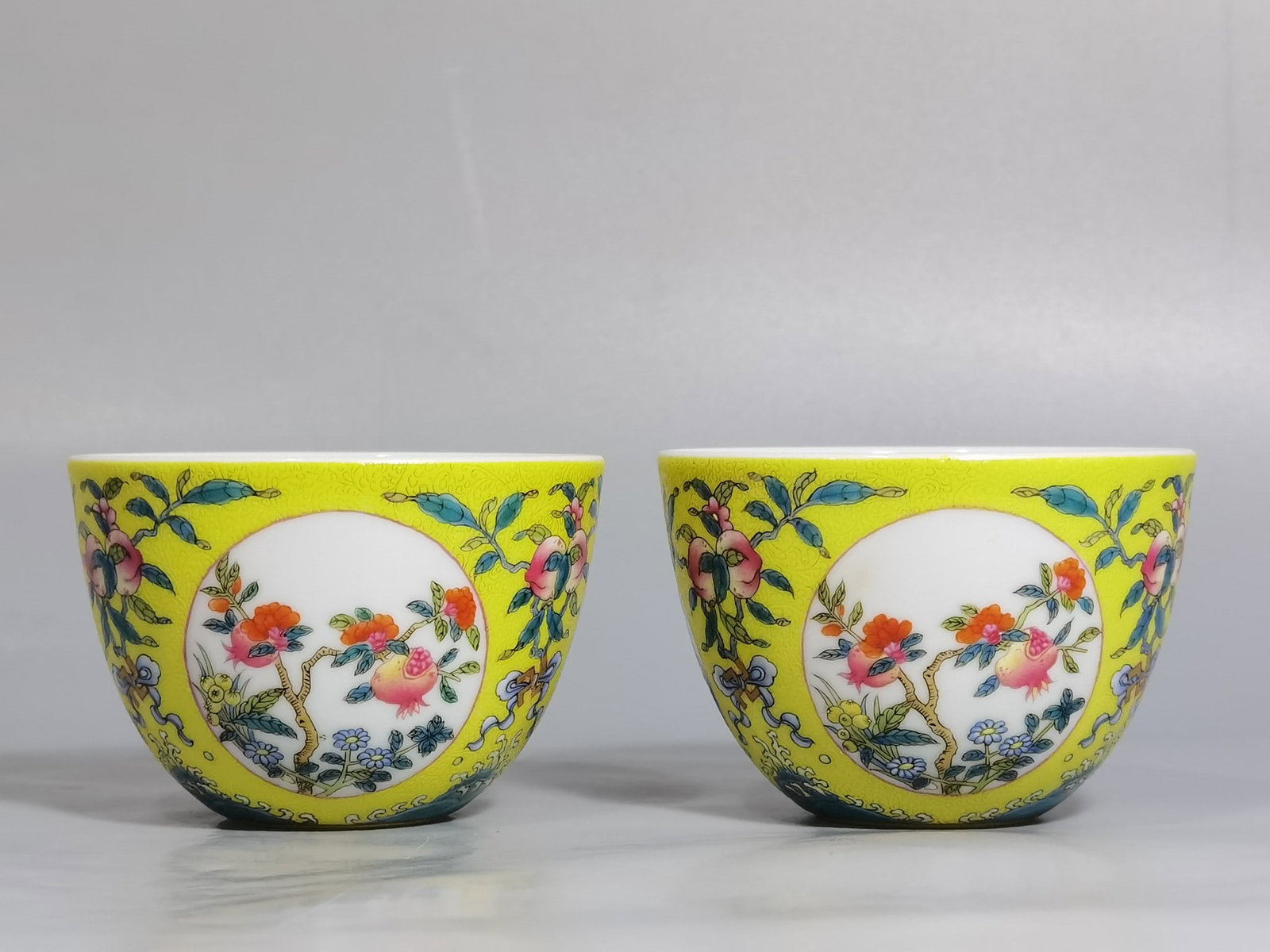A Pair of Exquisite Yellow Ground Enamel Pomegranate Pattern Cups