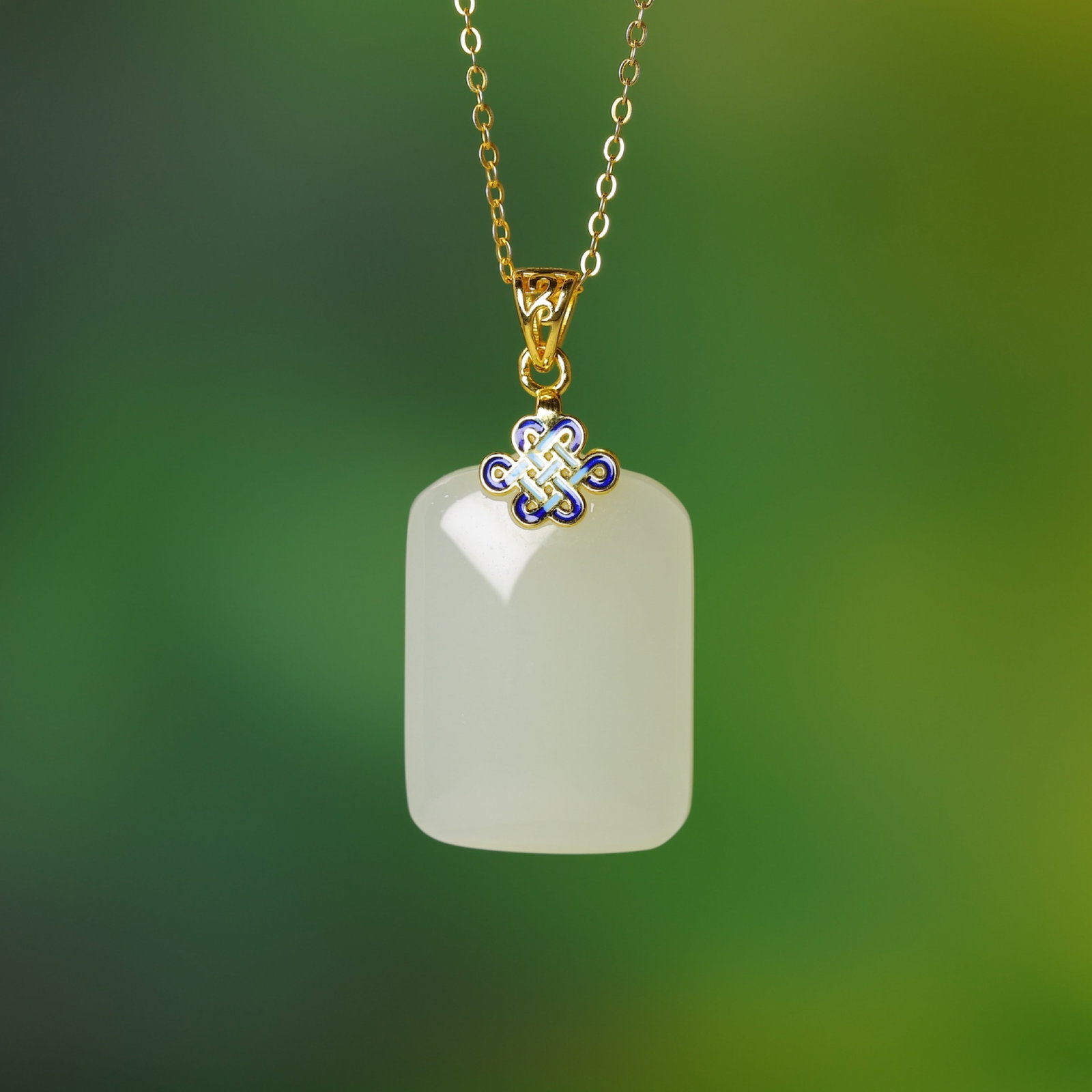An Exquisite Sterling Silver-Gold Plated Inlaid White Jade Pendant: An Exquisite Sterling Silver-Gold Plated Inlaid White Jade Pendant,Size:0.6inx0.9in 纯银镀金镶白玉吊坠
