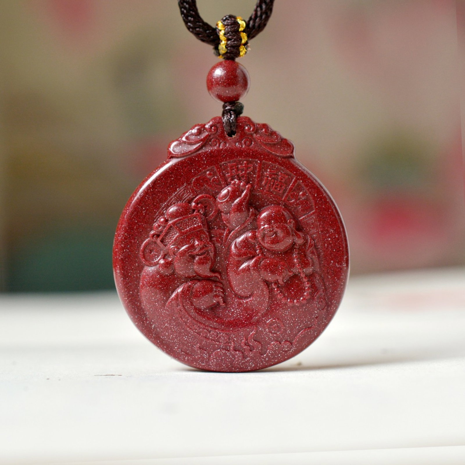 An Exquisite Cinnabar Pendant with Statue of Maitreya Buddha