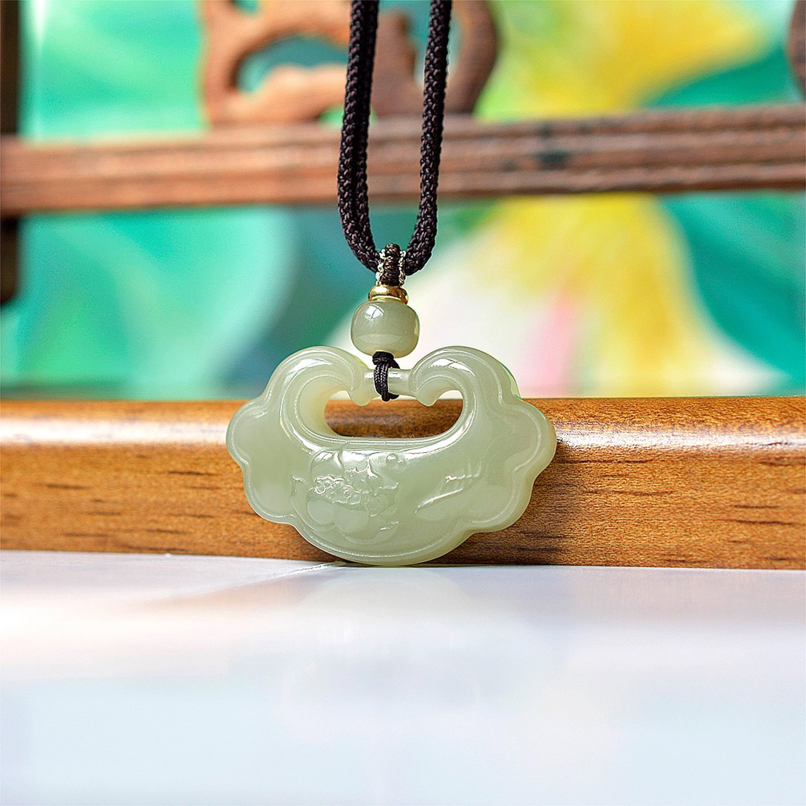 An Exquisite Greenish Jade Pendant