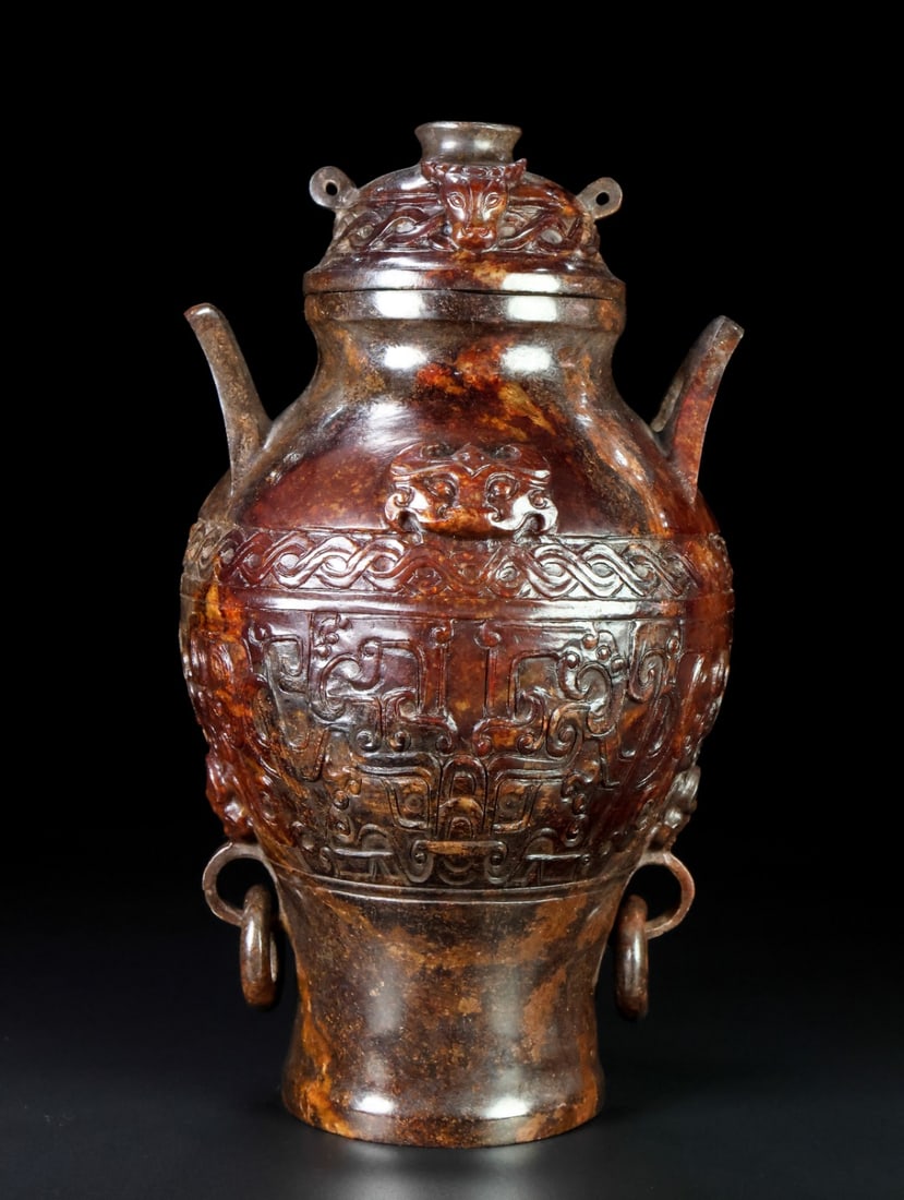 An Exquisite White Jade Beast-Face Pattern with Cover Double-Ears Vase: An Exquisite White Jade Beast-Face Pattern with Cover Double-Ears Vase,Han Dynasty,China,Size:8.7inx5in,Weight:2061g,白玉兽面纹带盖双耳瓶,&#