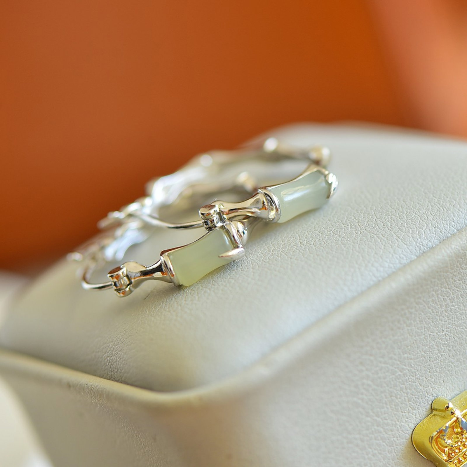 A Pair of Exquisite Sterling Silver Inlaid White Jade Earrings: A Pair of Exquisite Sterling Silver Inlaid White Jade Earrings,Size:4mmx7mm 一对精美的纯银镶白玉耳环