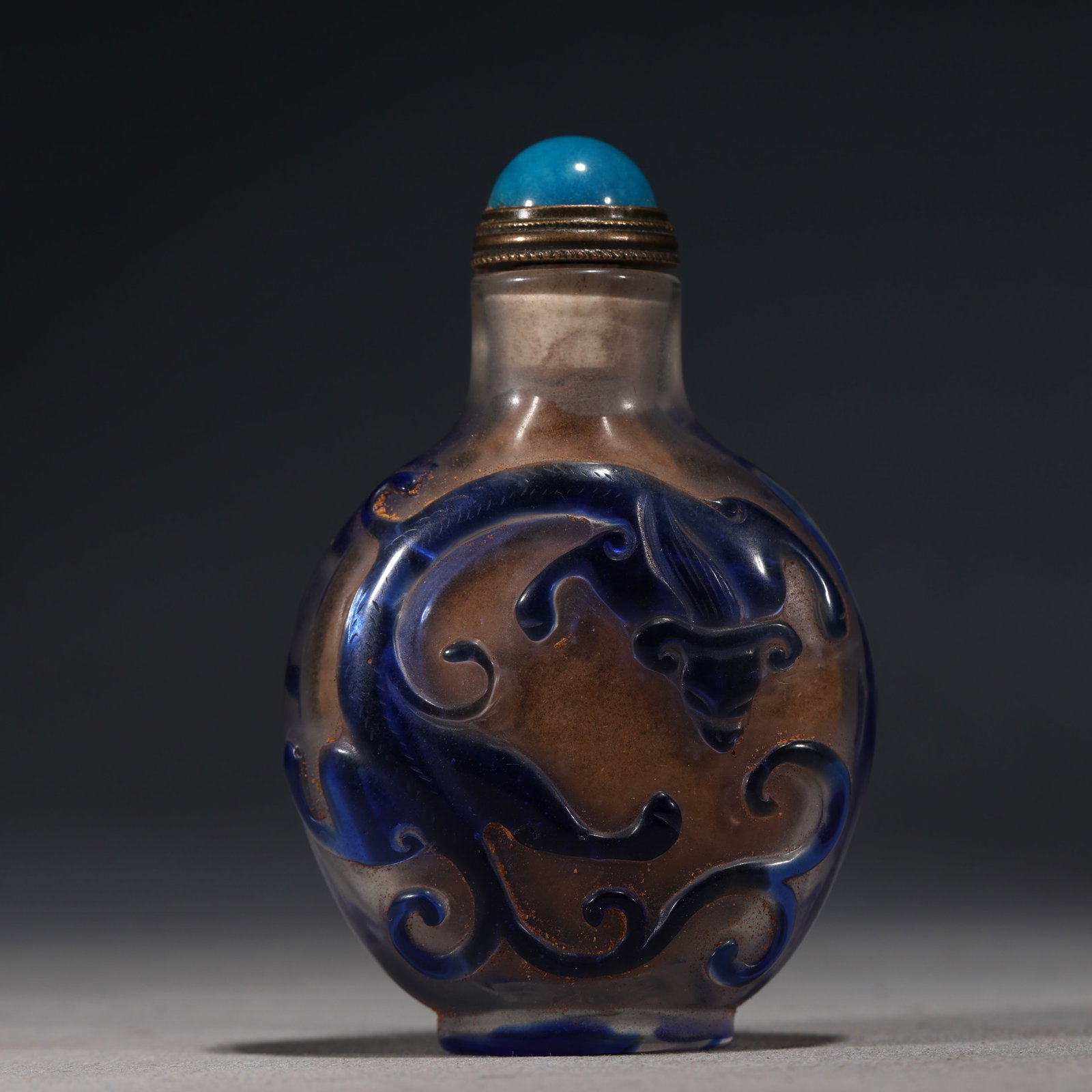 An Exquisite Overlaid Blue Glass Snuff Bottle With Chi Dragon Pattern: An Exquisite Overlaid Blue Glass Snuff Bottle With Chi Dragon Pattern,China,Qing Dynasty,Four-Character Qianlong Mark,Dimensions:3inx1.8in,套蓝琉璃螭龙纹Ɨ
