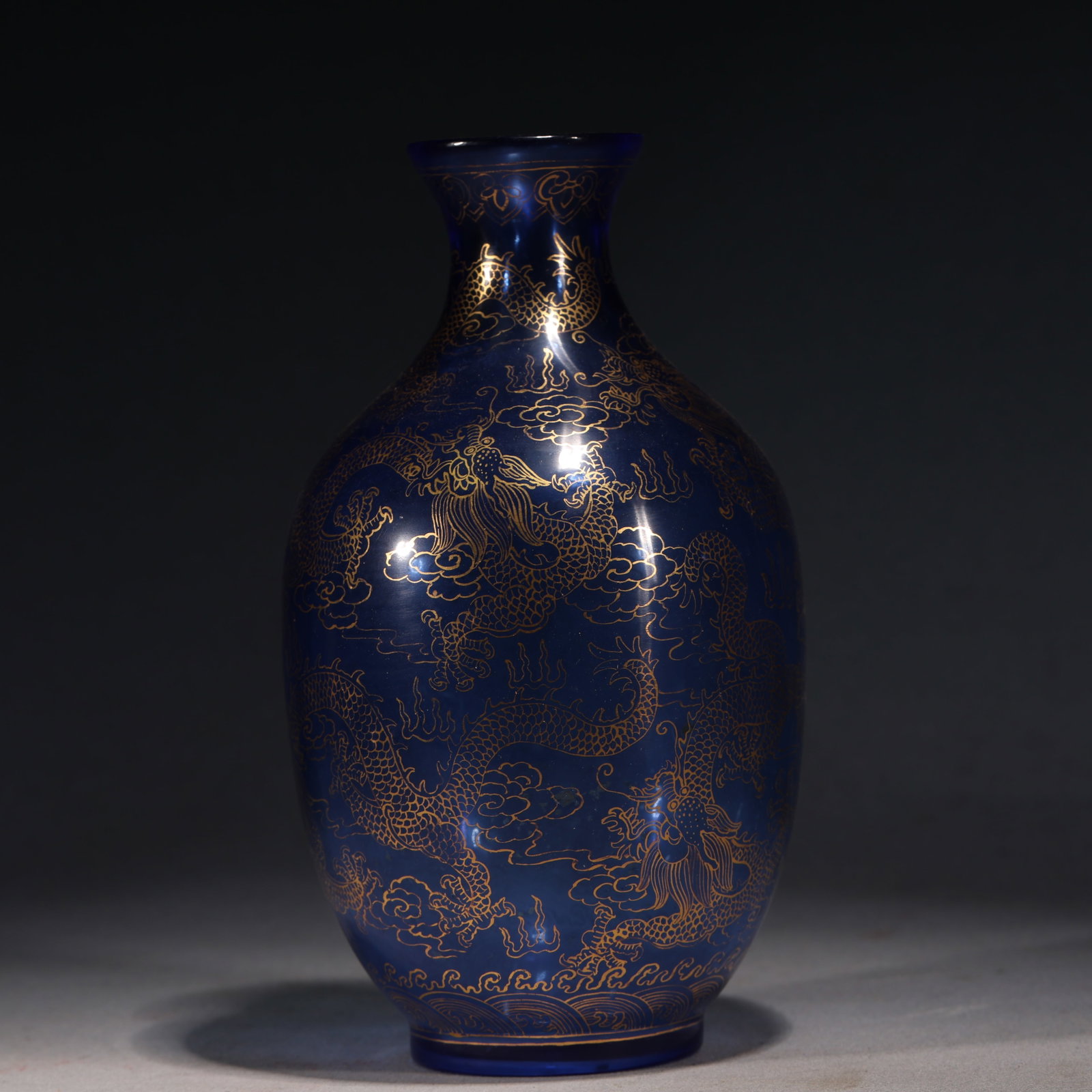 An Exquisite Sapphire Blue Glass Gold Traced Display Vase With Double Dragon And Cloud Dragon: An Exquisite Sapphire Blue Glass Gold Traced Display Vase With Double Dragon And Cloud Dragon Pattern，China, Qing Dynasty, Four-Character Qianlong Mark, Dimensions: 4.3inx4.3inx7.9in, Weight: 6