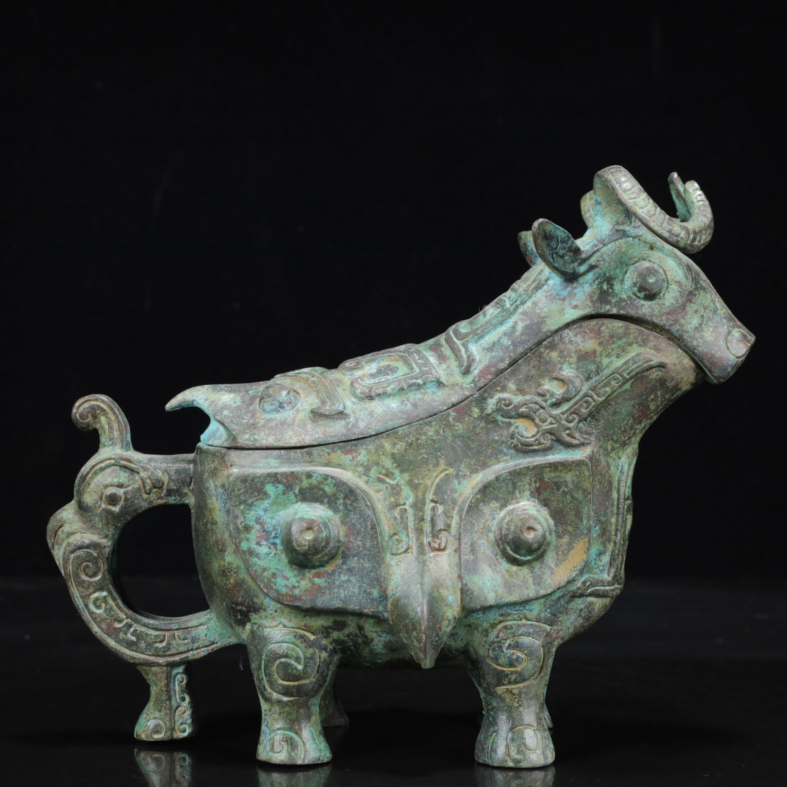 An Archaic Bronze Beast-Face Pattern Buffalo Cup: An Archaic Bronze Beast-Face Pattern Buffalo Cup,the Warring States Period in China,Size:7.9inx3.5inx6.3in,Weight:1250g 青铜兽面纹牛杯,中国战