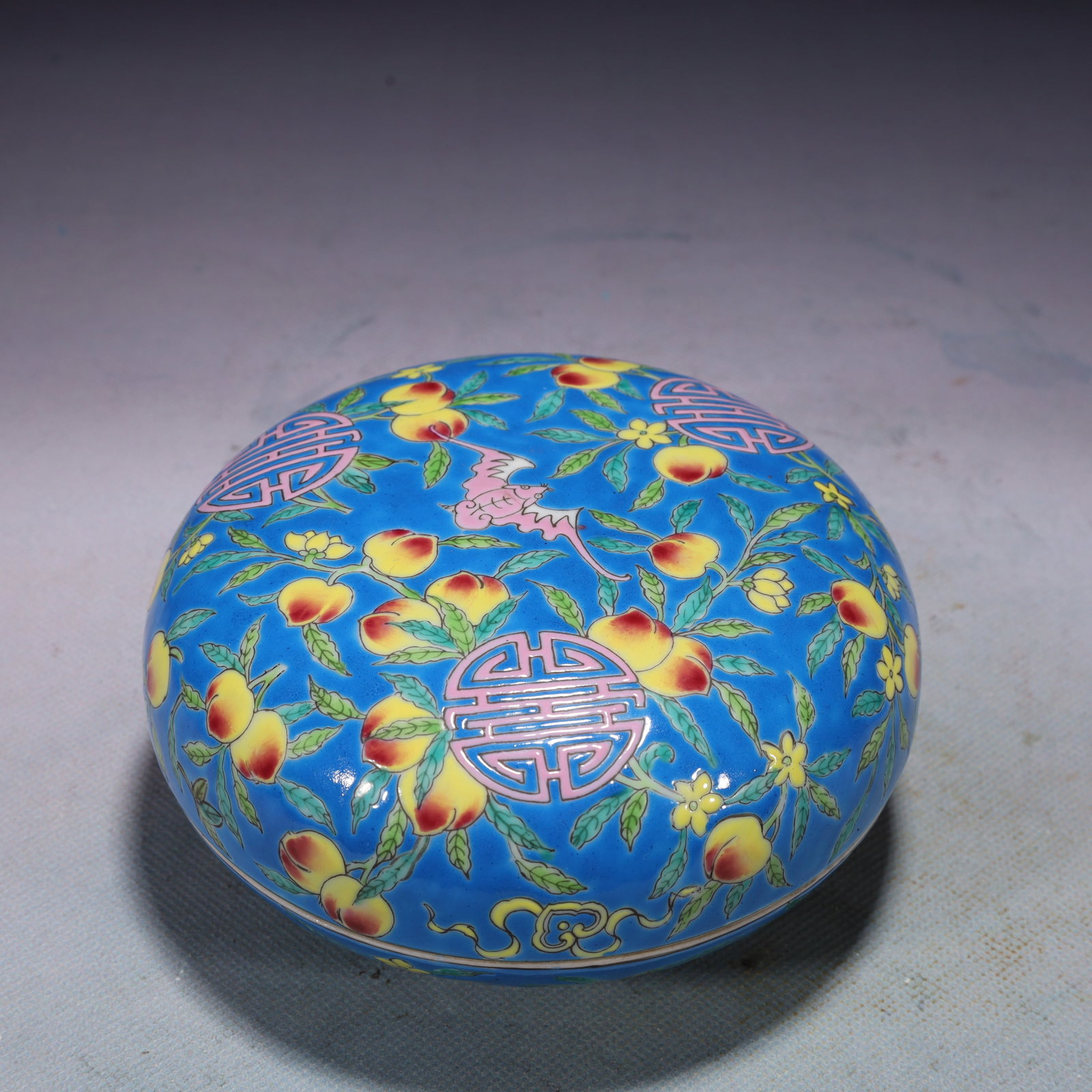 An Exquisite Blue Ground Famille-Rose Bats and Peach Pattern Box with Cover: An Exquisite Blue Ground Famille-Rose Bats and Peach Pattern Box with Cover,Qing Dynasty,China,Yongzheng Four-character Mark,Size:5.3inx2.4in,Weight:550g 蓝地粉彩福ळ