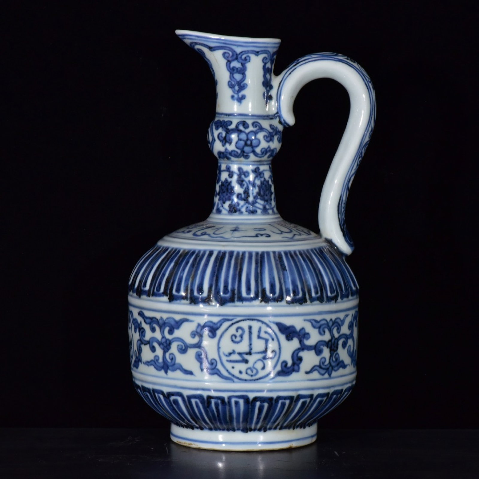 An Exquisite Blue and White Flower Pattern Watering Can,With Sanskrit: An Exquisite Blue and White Flower Pattern Watering Can,With Sanskrit,Ming Dynasty,China,Xuande Six-character Mark,Size:7.5inx6.3in 青花花卉纹花浇,带