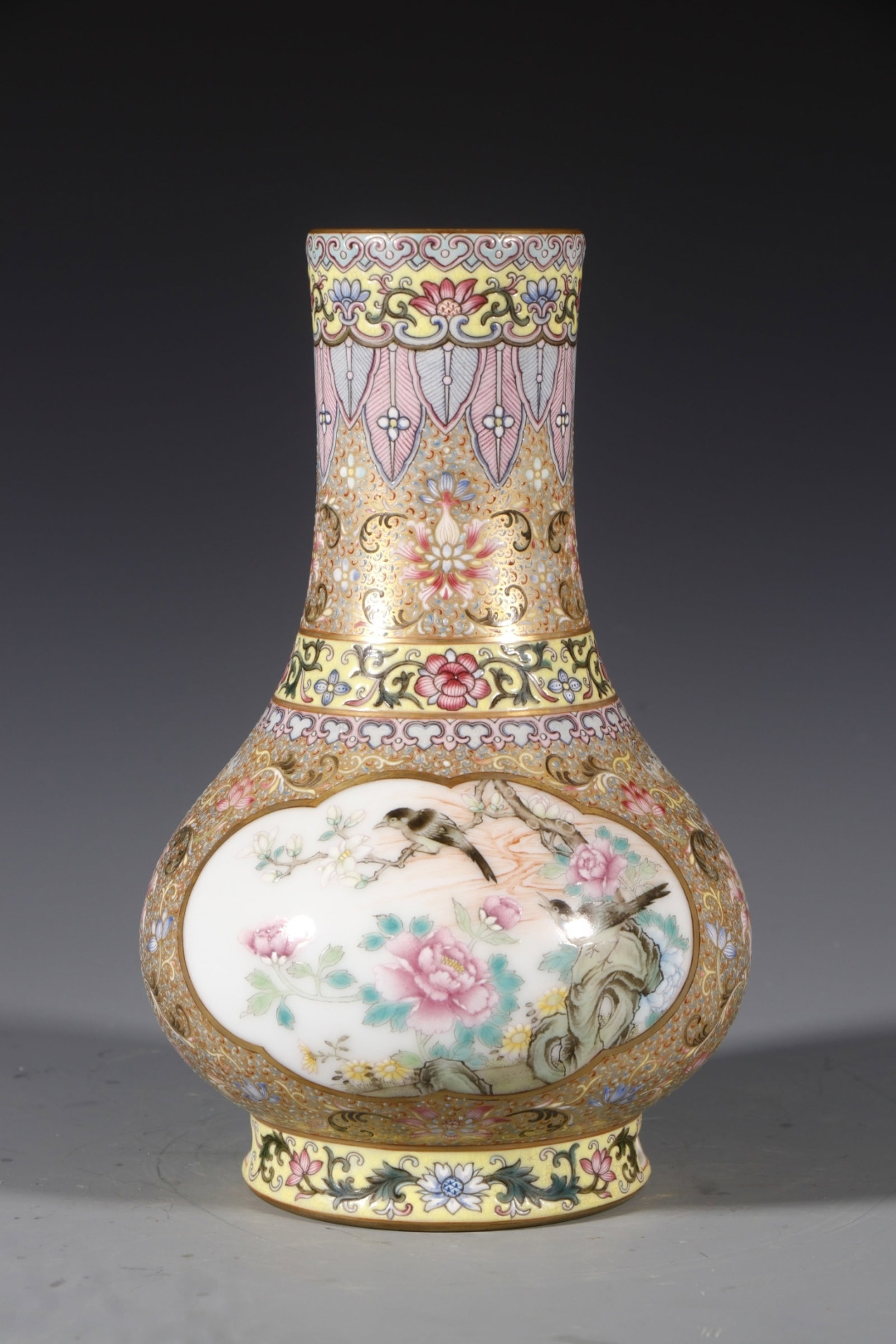An Exquisite Enamel Painted Gold Flower and Bird Pattern Vase: An Exquisite Enamel Painted Gold Flower and Bird Pattern Vase,Qing Dynasty,China,Qianlong Four-character Mark,Size:8.7inx3.5in 珐琅彩描金花鸟纹瓶,