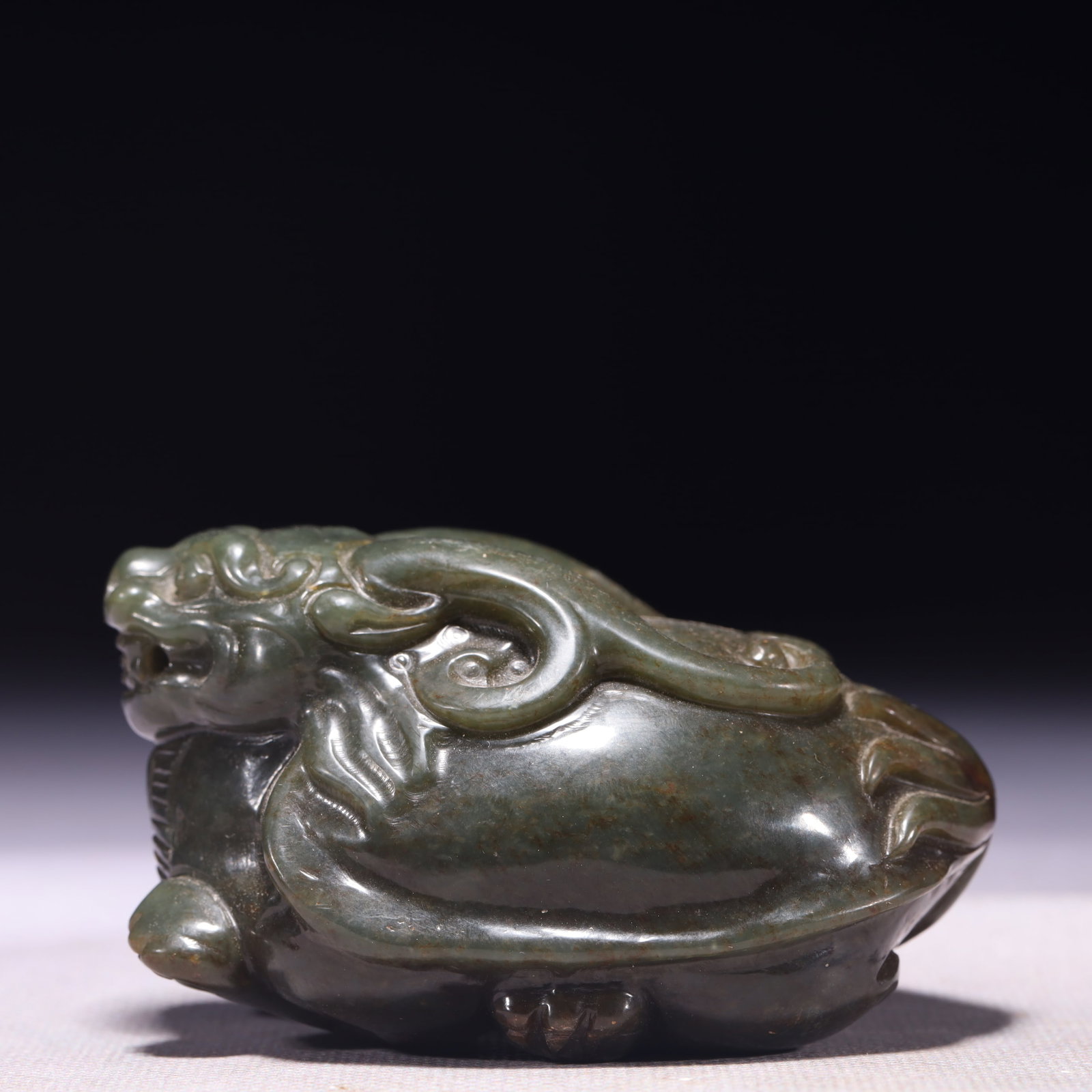 An Exquisite Green Jade Auspicious Beast Ornament: An Exquisite Green Jade Auspicious Beast Ornament,Qing Dynasty,China,Size:3.5inx2.4inx1.8in,Weight:391g 青玉瑞兽摆件,中国清代