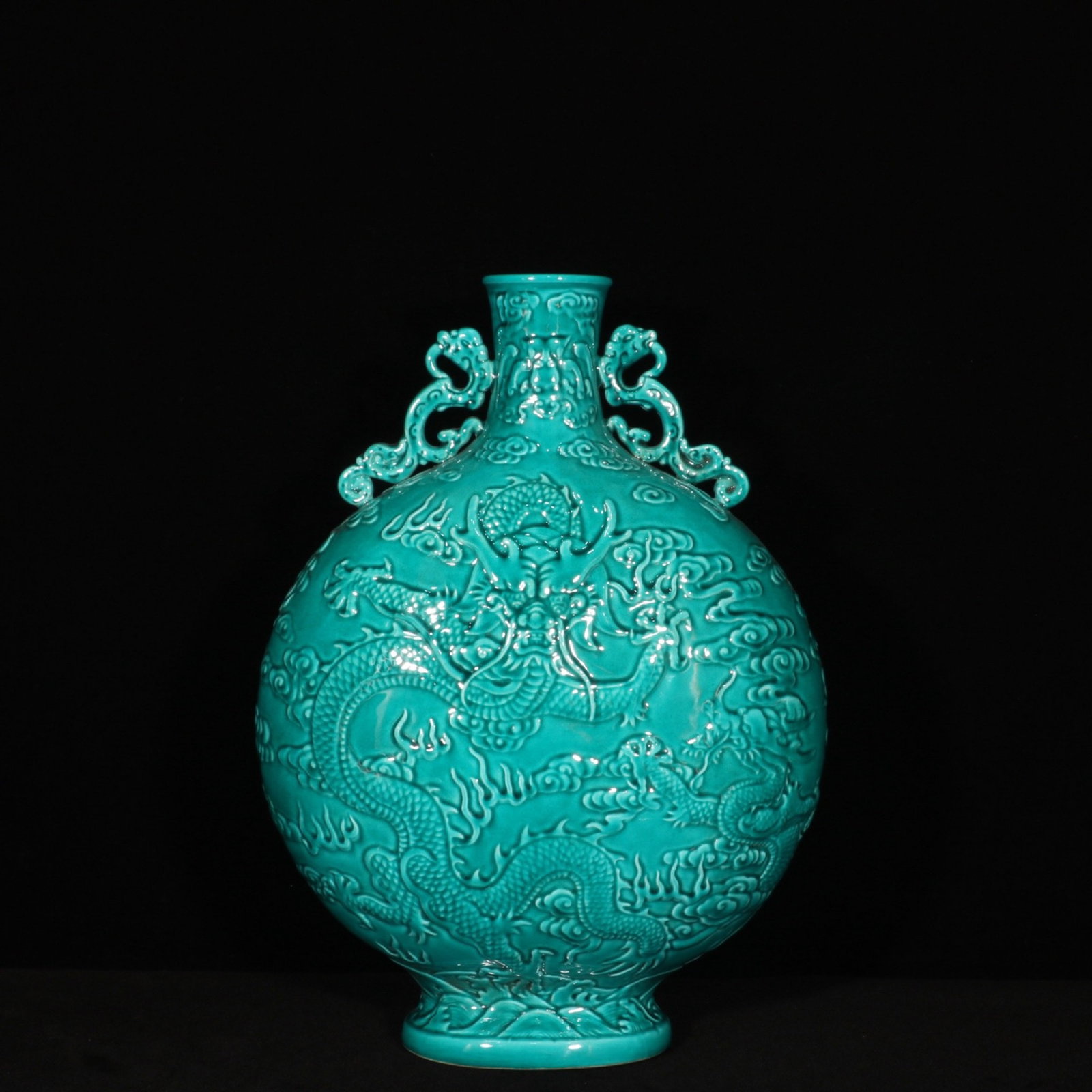 A Rare Green Glazed Auspicious Cloud and Dragon Pattern Double-Ears Vase: A Rare Green Glazed Auspicious Cloud and Dragon Pattern Double-Ears Vase,Qing Dynasty,China,Qianlong Six-character Mark,Size:15.2inx10.2in 绿釉祥云龙纹双ň