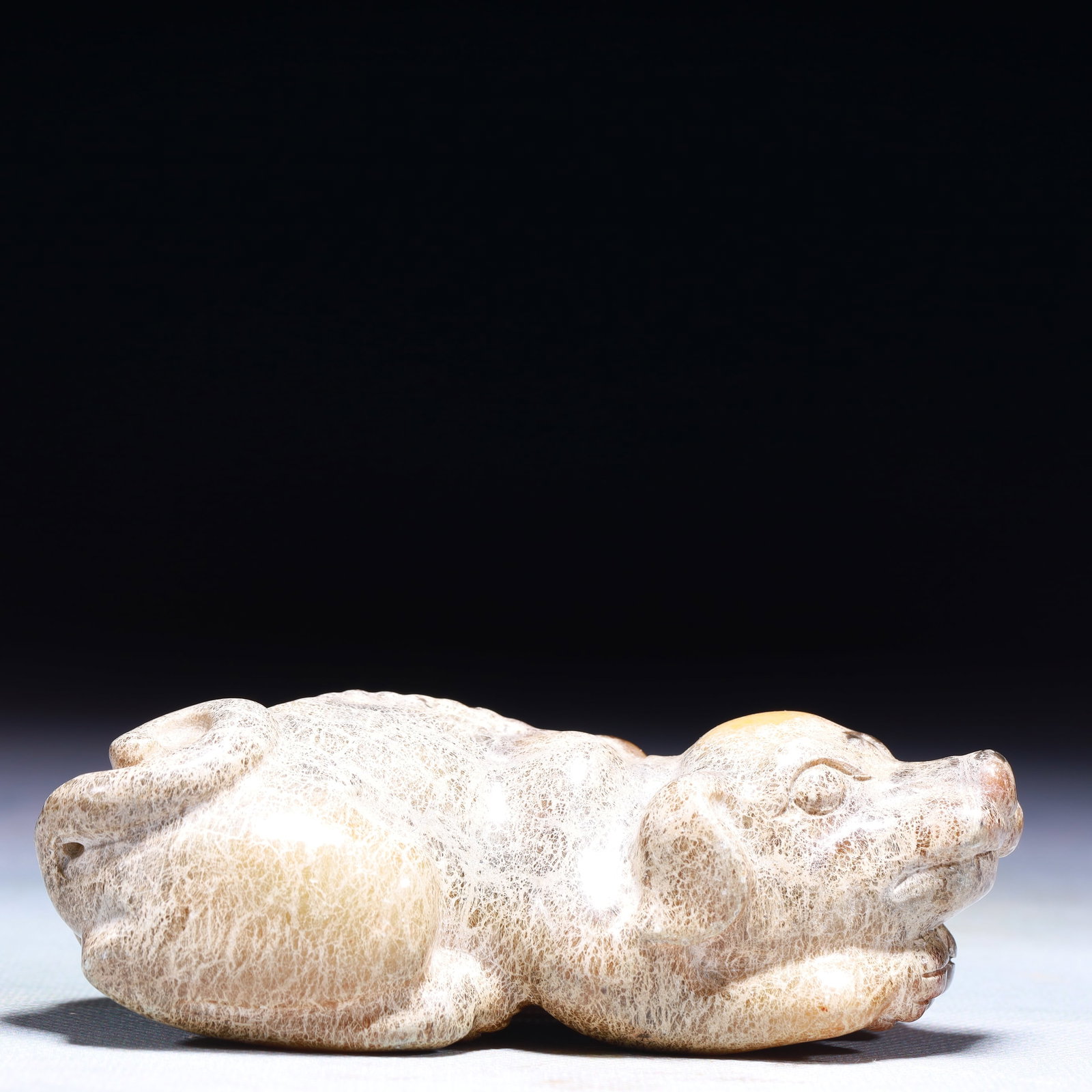 An Exquisite Archaic Jade Dog Ornament: An Exquisite Archaic Jade Dog Ornament,Ancient Time,China,Size:4.7inx1.6inx1.4in,Weight:346g 高古玉犬摆件中国远古时期
