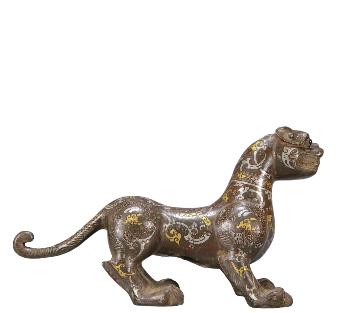 A Exquisite Gold and Silver-Inlaid Bronze Tiger Ornament: A Exquisite Gold and Silver-Inlaid Bronze Tiger Ornament Ancient Time, China ,Size:12.6inx4.3inx7.5in Weight:2100g 铜错金银虎兽 远古时期