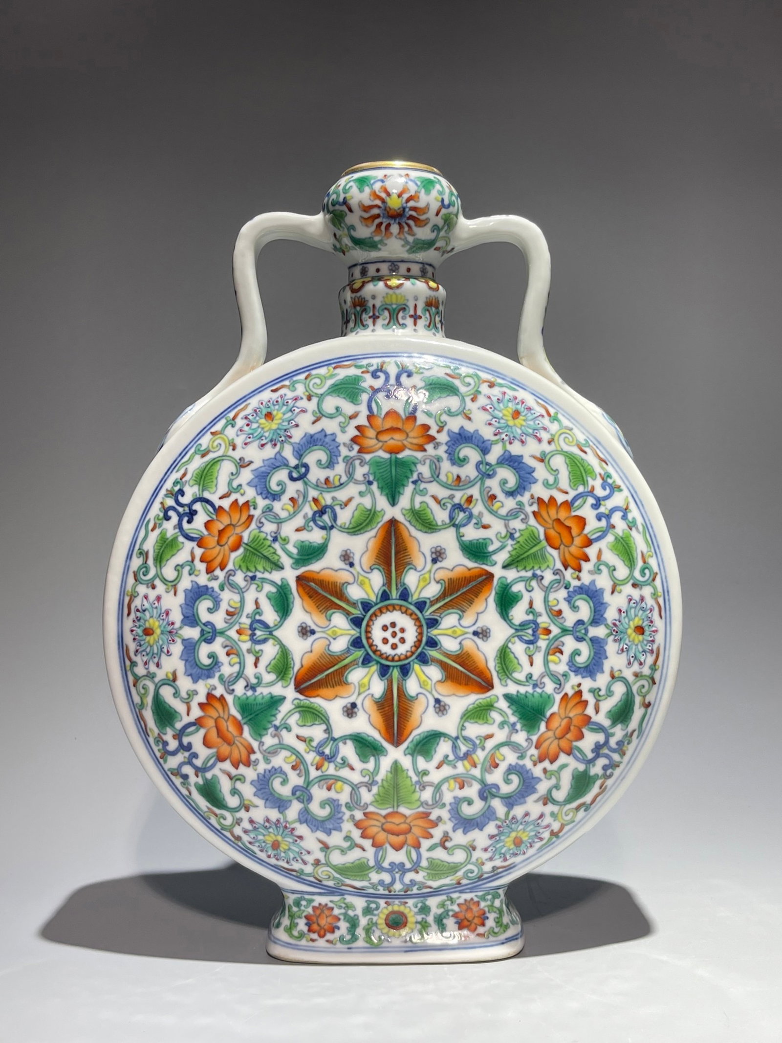An Exquisite Doucai Painted Gold Lotus Pattern Double-Ears Vase: An Exquisite Doucai Painted Gold Lotus Pattern Double-Ears Vase,Qing Dynasty,China,Qianlong Six-character Mark,Size:11.6inx8.3in 斗彩描金缠枝莲纹双