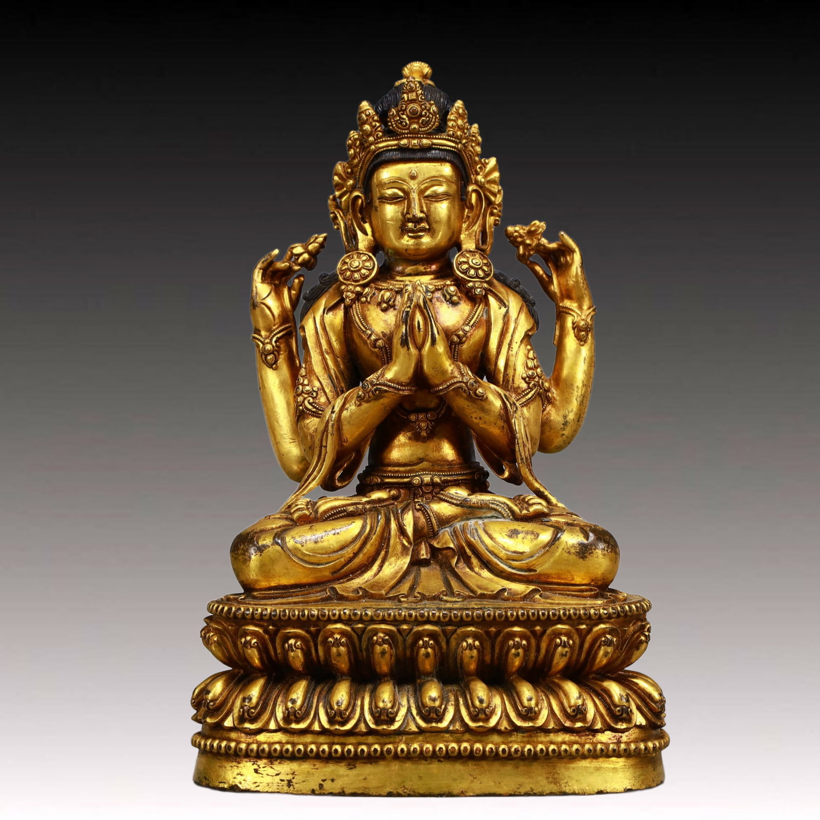 A Solemn Gilt Bronze Statue of Four-arms Guanyin: A Solemn Gilt Bronze Statue of Four-arms Guanyin,Ming Dynasty, China,Yongle Six-character Mark,Size:6.3inx4.7inx10.2in,Weight:4300g 铜鎏金四臂观音像,