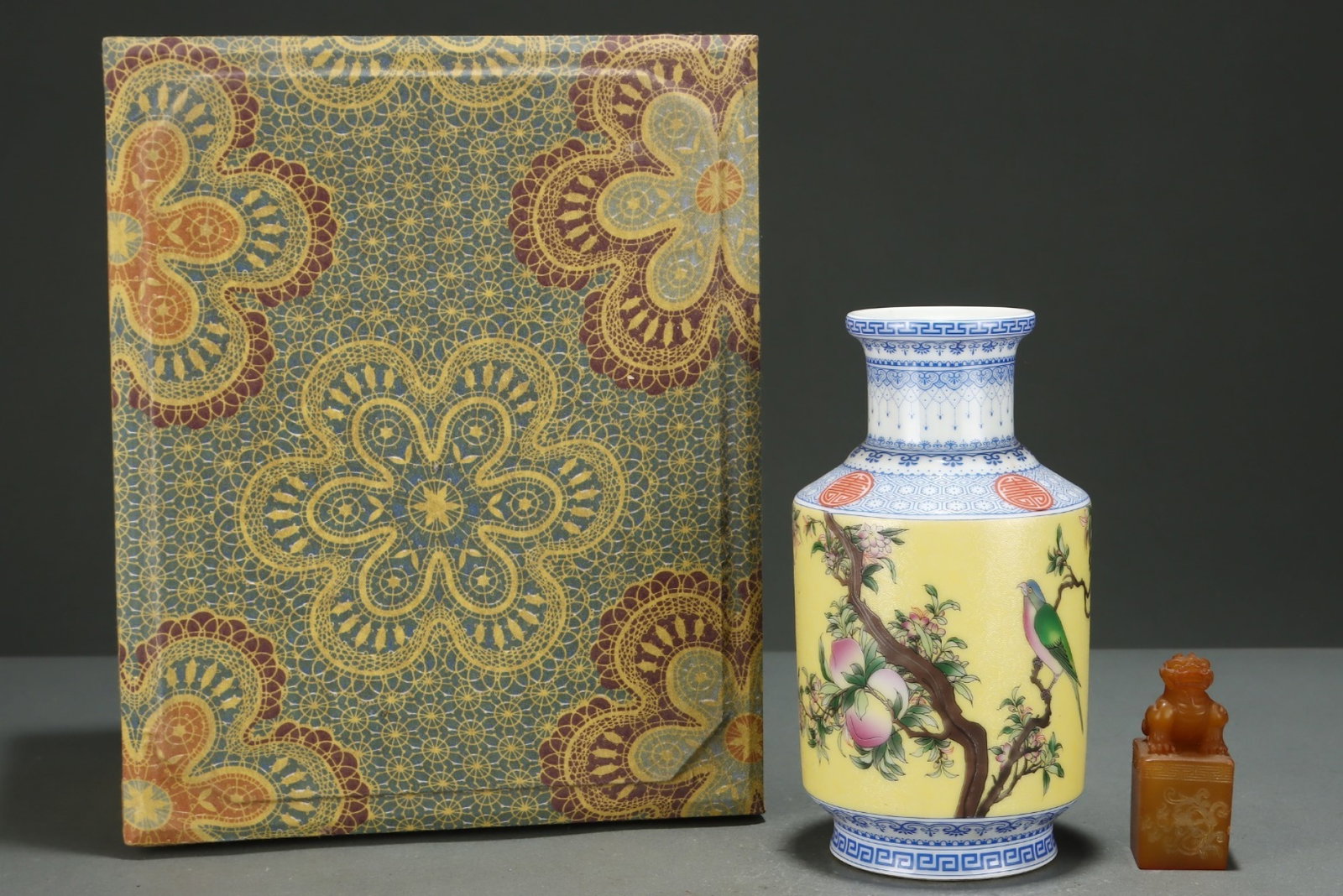 An Exquisite Yellow Ground Famille-Rose Flower and Bird Pattern Vase: An Exquisite Yellow Ground Famille-Rose Flower and Bird Pattern Vase,Qing Dynasty,China,Qianlong Four-character Mark,Size:(Porcelain)7.7inx4.1in,(Jade)3inx1.3in 黄地粉彩花