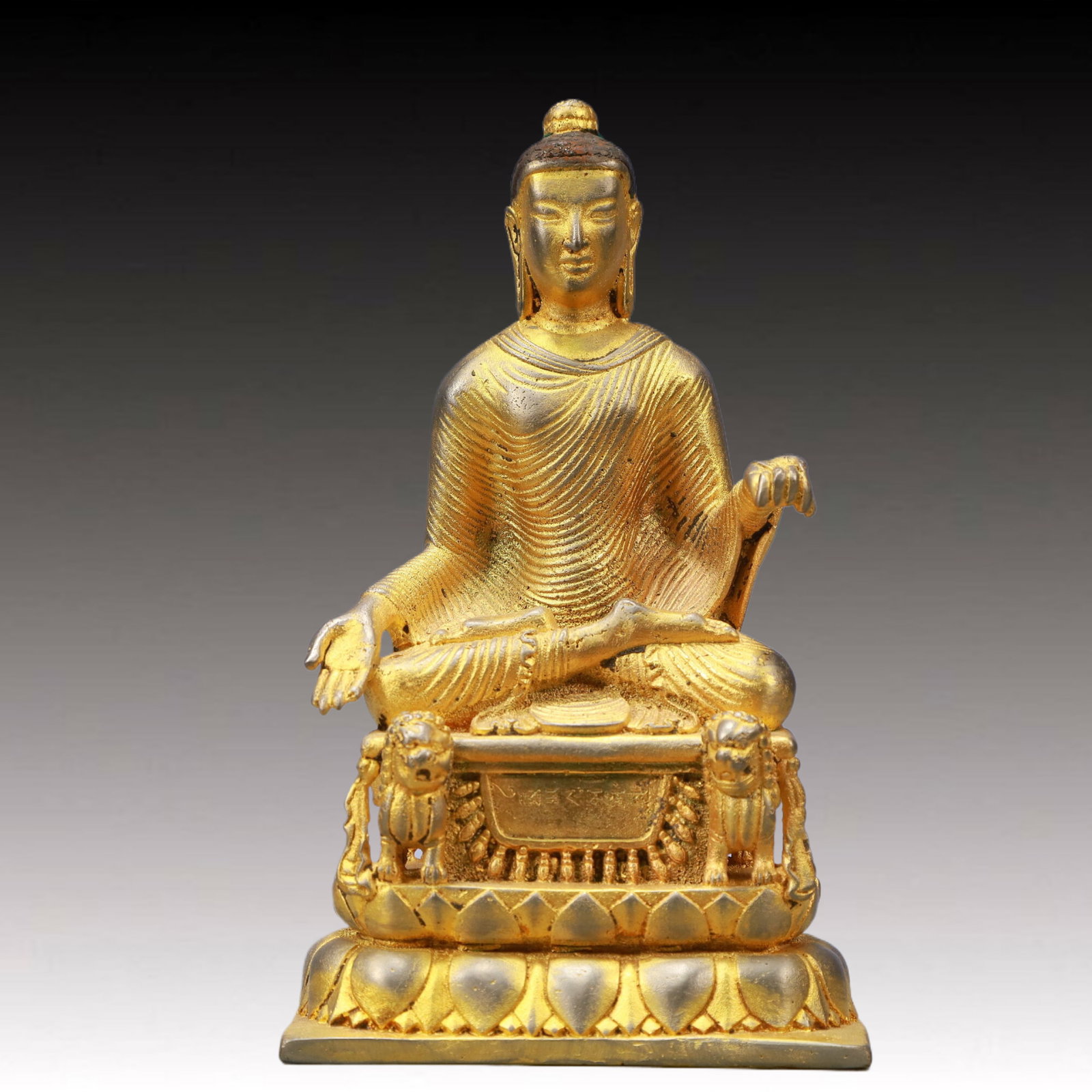 A Solemn Gilt Bronze Statue of Sakyamuni: A Solemn Gilt Bronze Statue of Sakyamuni,Ming Dynasty, China,Size:4.7inx3.3inx8.3inWeight:1800g 铜鎏金释迦牟尼像,中国明代