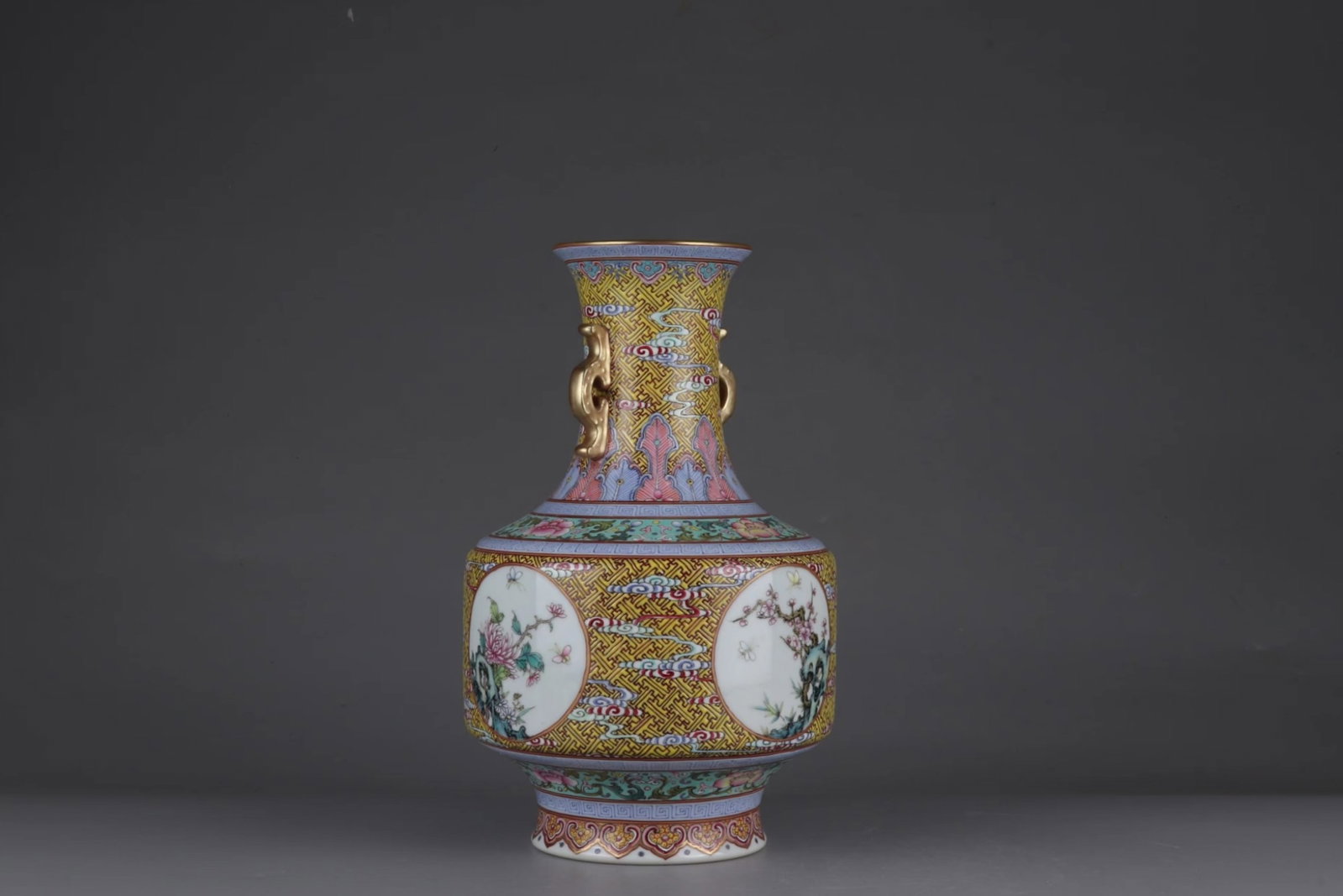An Exquisite Famille-Rose Painted Gold Flower Pattern Double-Ears Vase: An Exquisite Famille-Rose Painted Gold Flower Pattern Double-Ears Vase,Qing Dynasty,China,Qianlong Six-character Mark,Size:11.6inx7.1in 粉彩描金花卉纹双