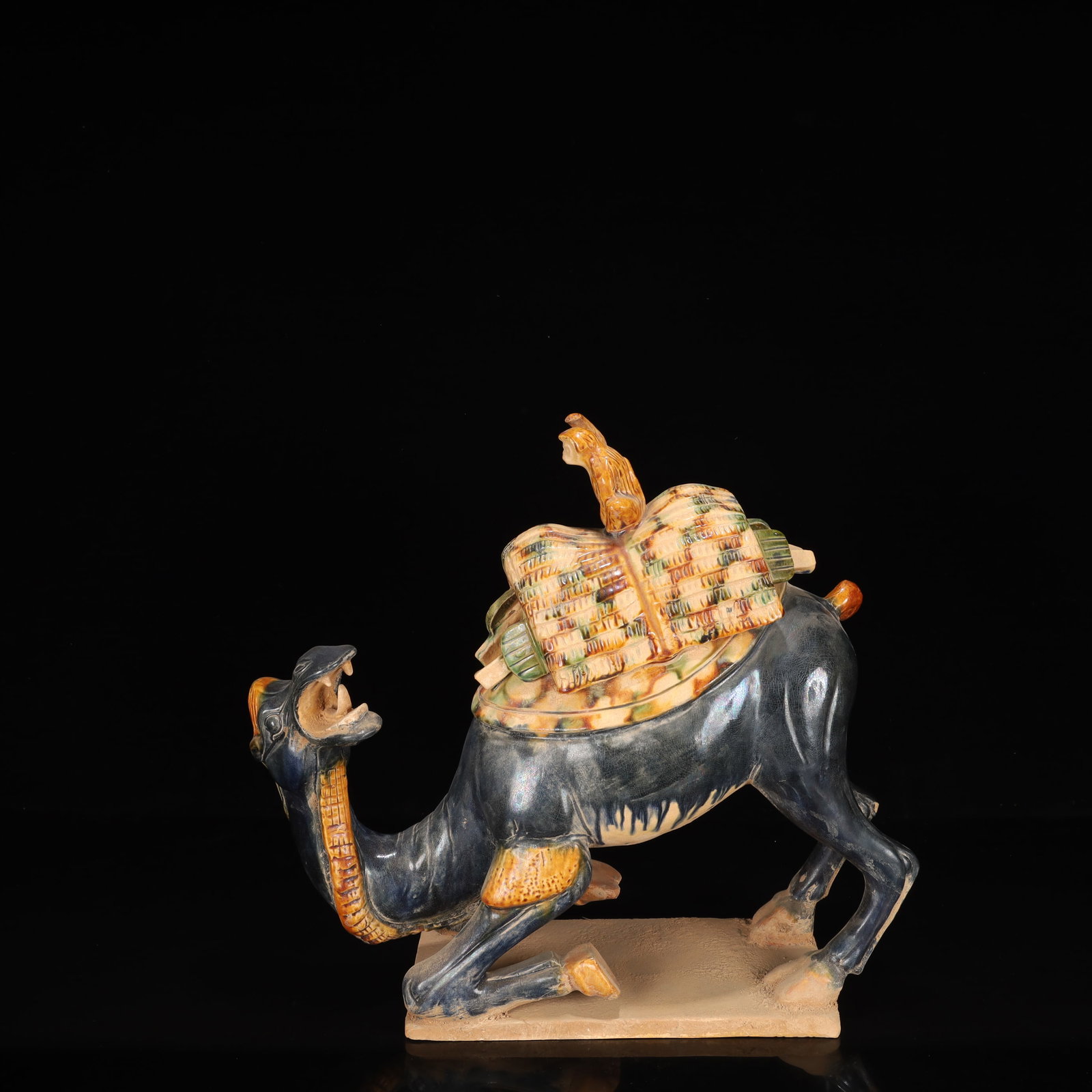 A Rare Tang Tri-Color Glazed Pottery Camel Ornament: A Rare Tang Tri-Color Glazed Pottery Camel Ornament,Tang Dynasty, China,Chinese Tang Tri-colored Pottery, or Tang Sancai, flourished during the Tang Dynasty (618–907 AD). It's renowned for its v