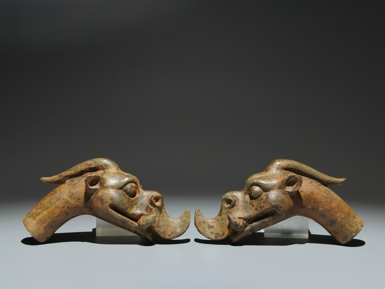 A Pair of Archaic Bronze Dragon Ornaments: A Pair of Archaic Bronze Dragon Ornaments,the Warring States period in China,Size:3.7inx7.1inx2.8in 一对青铜龙摆件,中国战国时