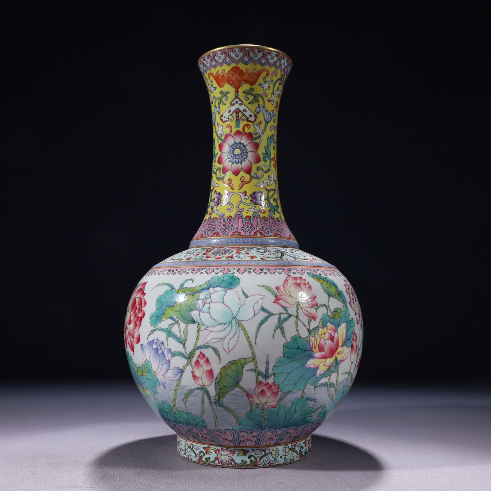 An Exquisite Yellow Ground Famille-Rose Painted Gold Lotus Pattern Vase: An Exquisite Yellow Ground Famille-Rose Painted Gold Lotus Pattern Vase,Qing Dynasty,China,Yongzheng Six-character Mark,Size:8.7inx15.7in,Weight:3300g