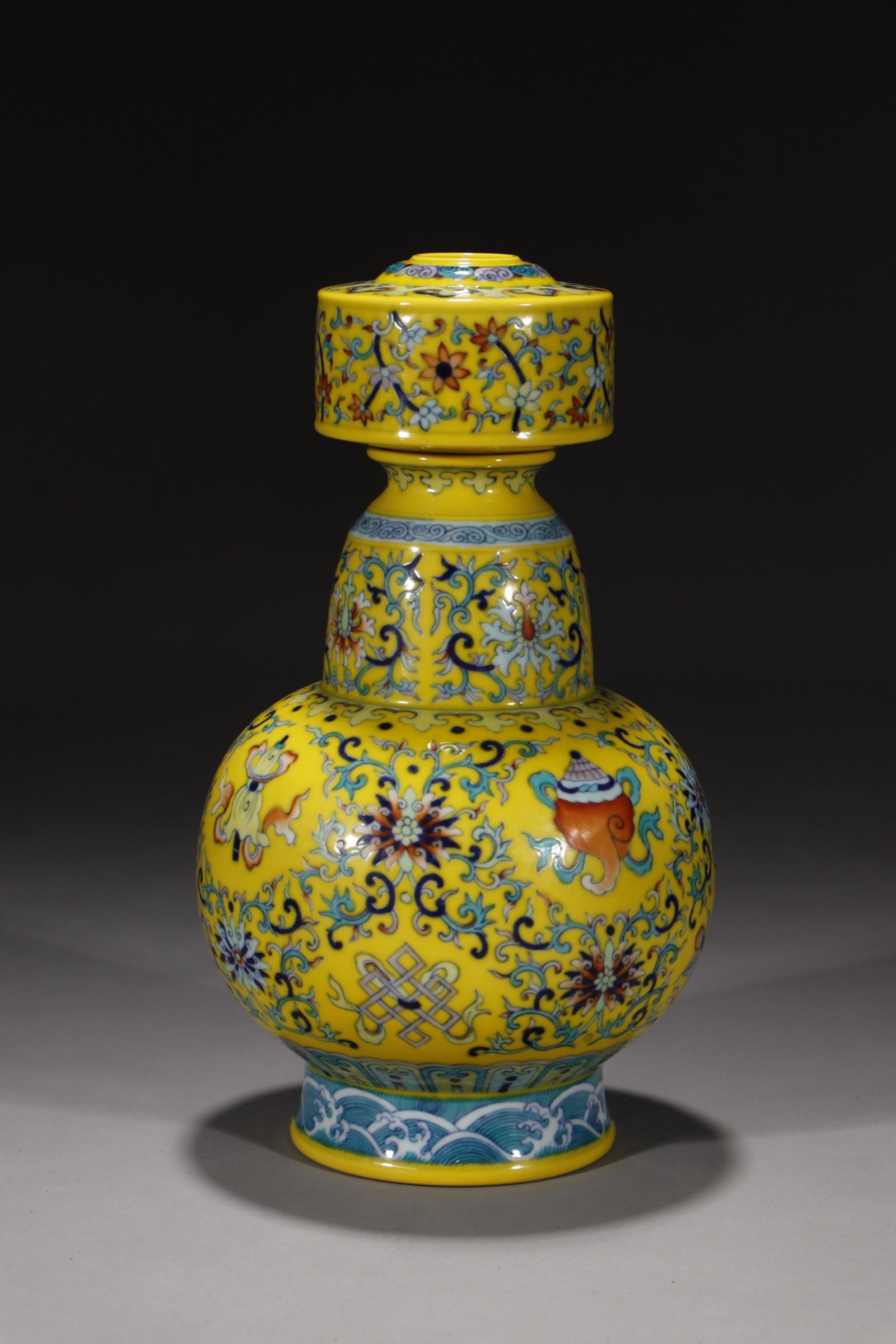 An Exquisite Yellow Ground Doucai Lotus and Eight Treasures Pattern Vase: An Exquisite Yellow Ground Doucai Lotus and Eight Treasures Pattern Vase,Qing Dynasty,China,Qianlong Six-character Mark,Size:10.4in 黄地斗彩缠枝莲八
