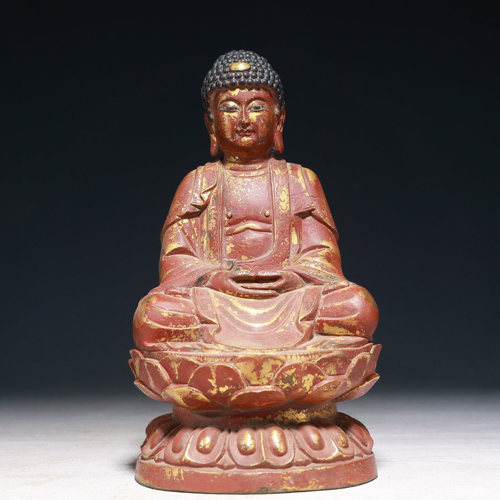 A Solemn Gilt Bronze Statue of Sakyamuni: A Solemn Gilt Bronze Statue of Sakyamuni,Qing Dynasty,China,Size:4.7inx4.5inx8.7in,Weight:2400g 铜漆金如来像,中国清代