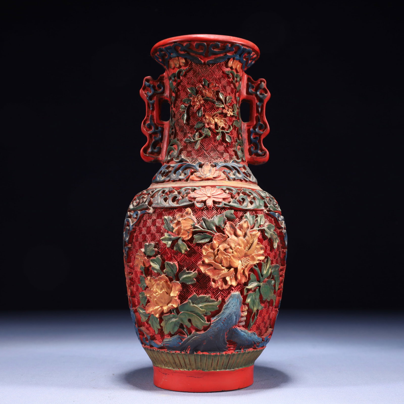 An Exquisite Carved Red Lacquer Flower Pattern Double-Ears Vase: An Exquisite Carved Red Lacquer Flower Pattern Double-Ears Vase,Qing Dynasty,China,With Mark,Size:4.3inx9.4in,Weight:600g 剔红漆花卉纹双耳瓶,È