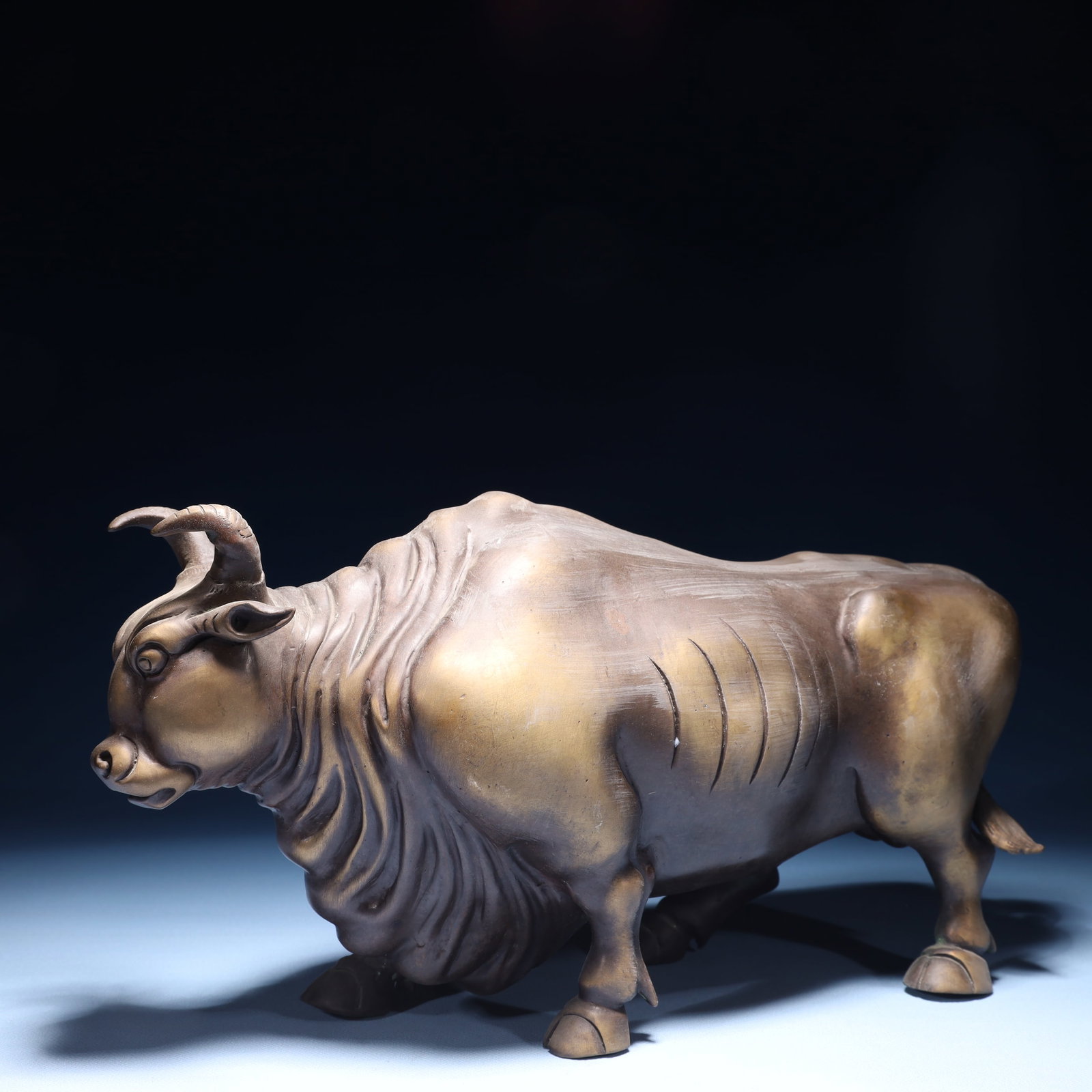 An Exquisite Bronze Buffalo Ornament: An Exquisite Bronze Buffalo Ornament,Qing Dynasty,China,Size:13.4inx4.7inx7.5in,Weight:4500g 铜牛摆件,中国清代
