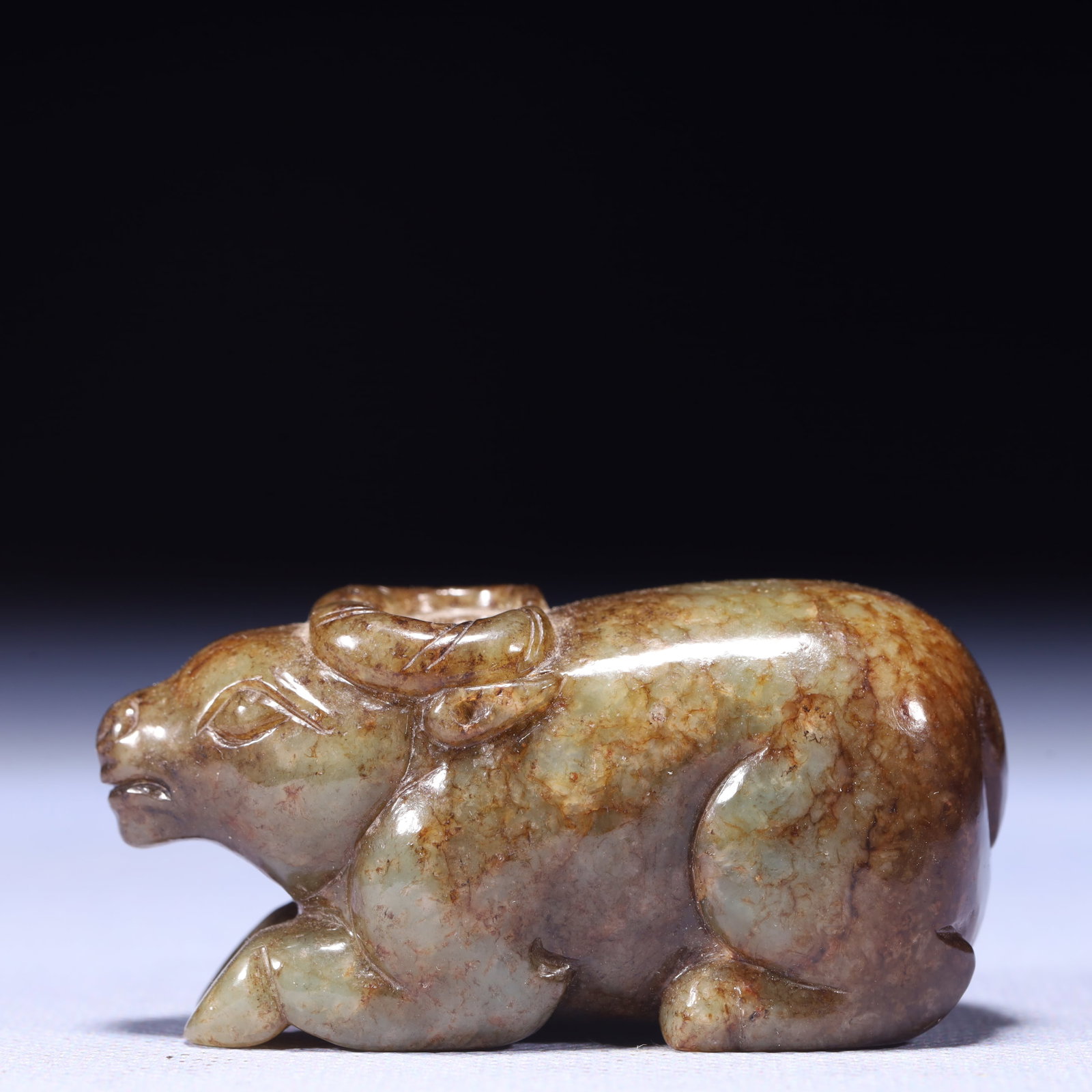 An Exquisite Green Jade Buffalo Ornament: An Exquisite Green Jade Buffalo Ornament,Qing Dynasty,China,Size:2.6inx1inx1.2in,Weight:133g 青玉牛摆件,中国清代