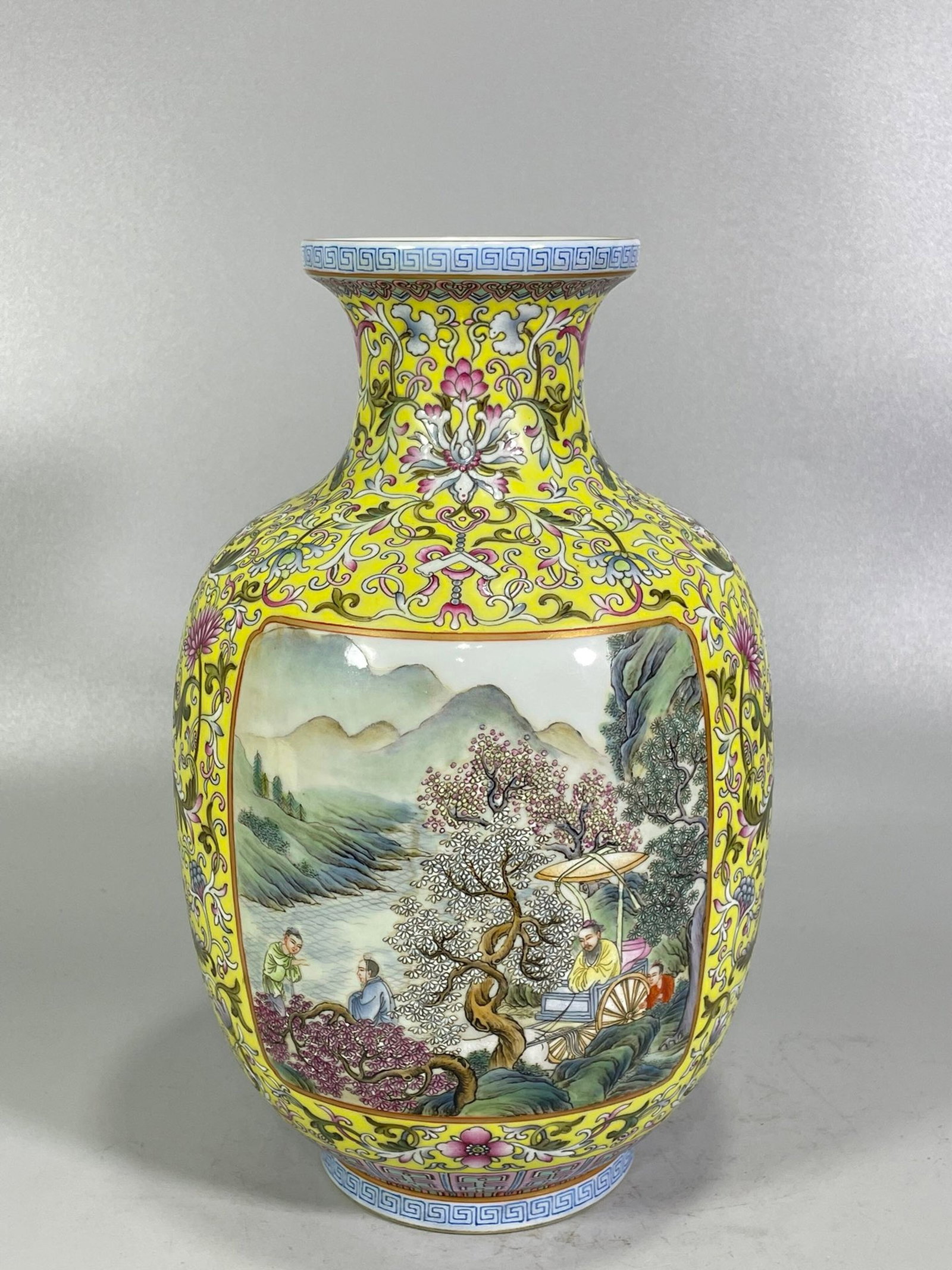 An Exquisite Yellow Ground Famille-Rose Painted Gold Landscape and Figure Pattern Vase: An Exquisite Yellow Ground Famille-Rose Painted Gold Landscape and Figure Pattern Vase,Qing Dynasty,China,Qianlong Four-character Mark,Size:10.6inx6.7in 黄地粉彩描金
