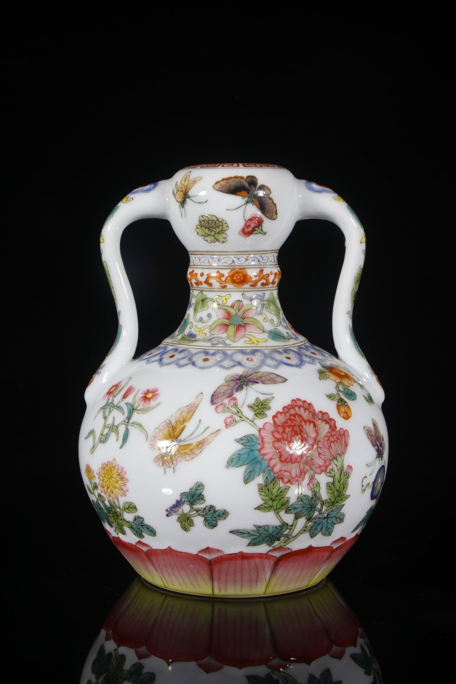 An Exquisite Enamel Flower and Butterfly Pattern Double-Ears Vase: An Exquisite Enamel Flower and Butterfly Pattern Double-Ears Vase,Qing Dynasty,China,Qianlong Six-character Mark,Size:9.3inx3.9in 珐琅彩花卉蝴蝶纹ࡡ