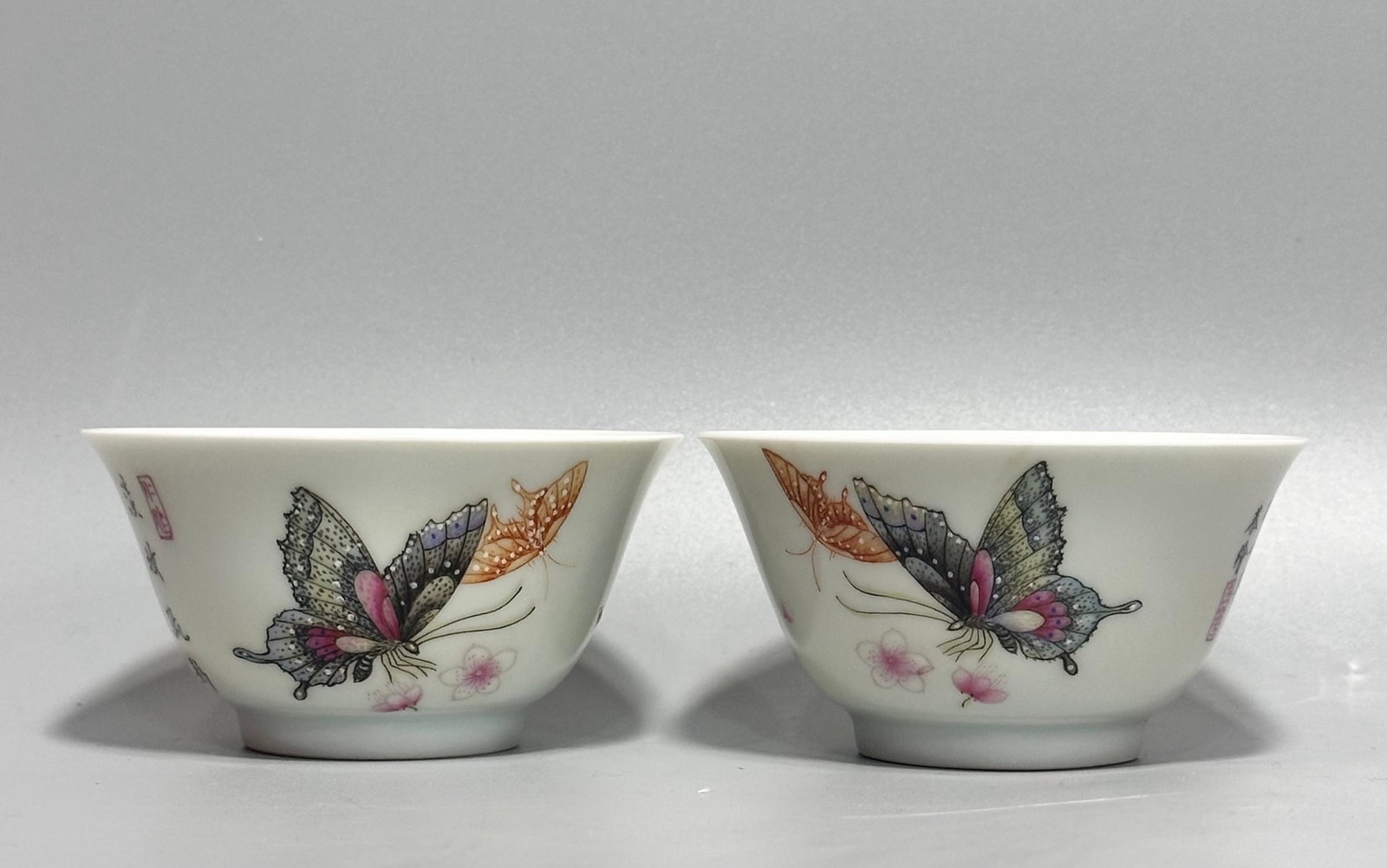 A Pair of Exquisite Famille-Rose Flower and Butterfly Pattern Cups,with poem: A Pair of Exquisite Famille-Rose Flower and Butterfly Pattern Cups,with poem,Qing Dynasty,China,Yongzheng Four-character Mark,Size:1.8inx3.5in 一对粉彩花卉蝴&