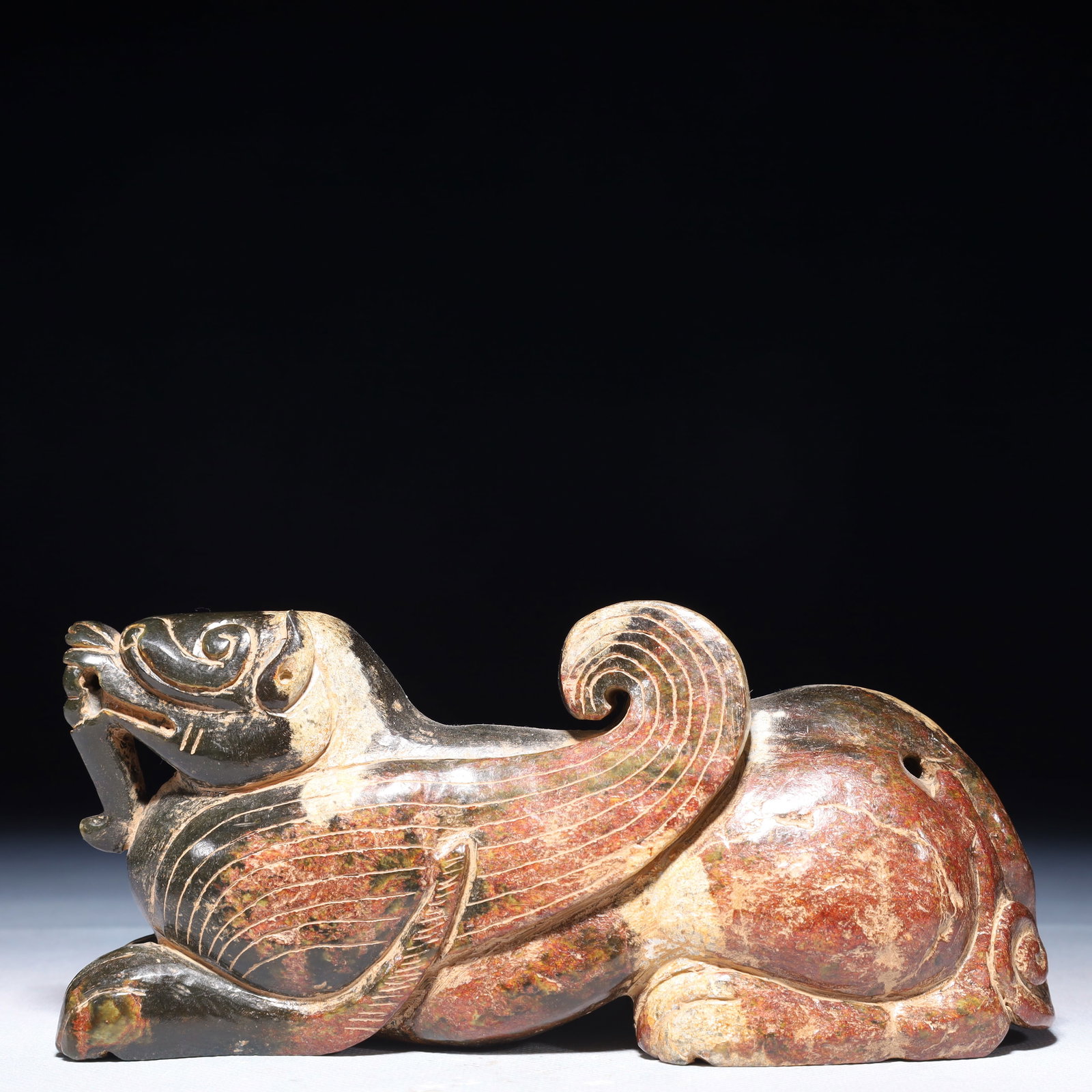 An Exquisite Green Jade Beast Ornament: An Exquisite Green Jade Beast Ornament,Qing Dynasty,China,Size:7.5inx2.4inx3.3in,Weight:1450g 青玉兽摆件,中国清代