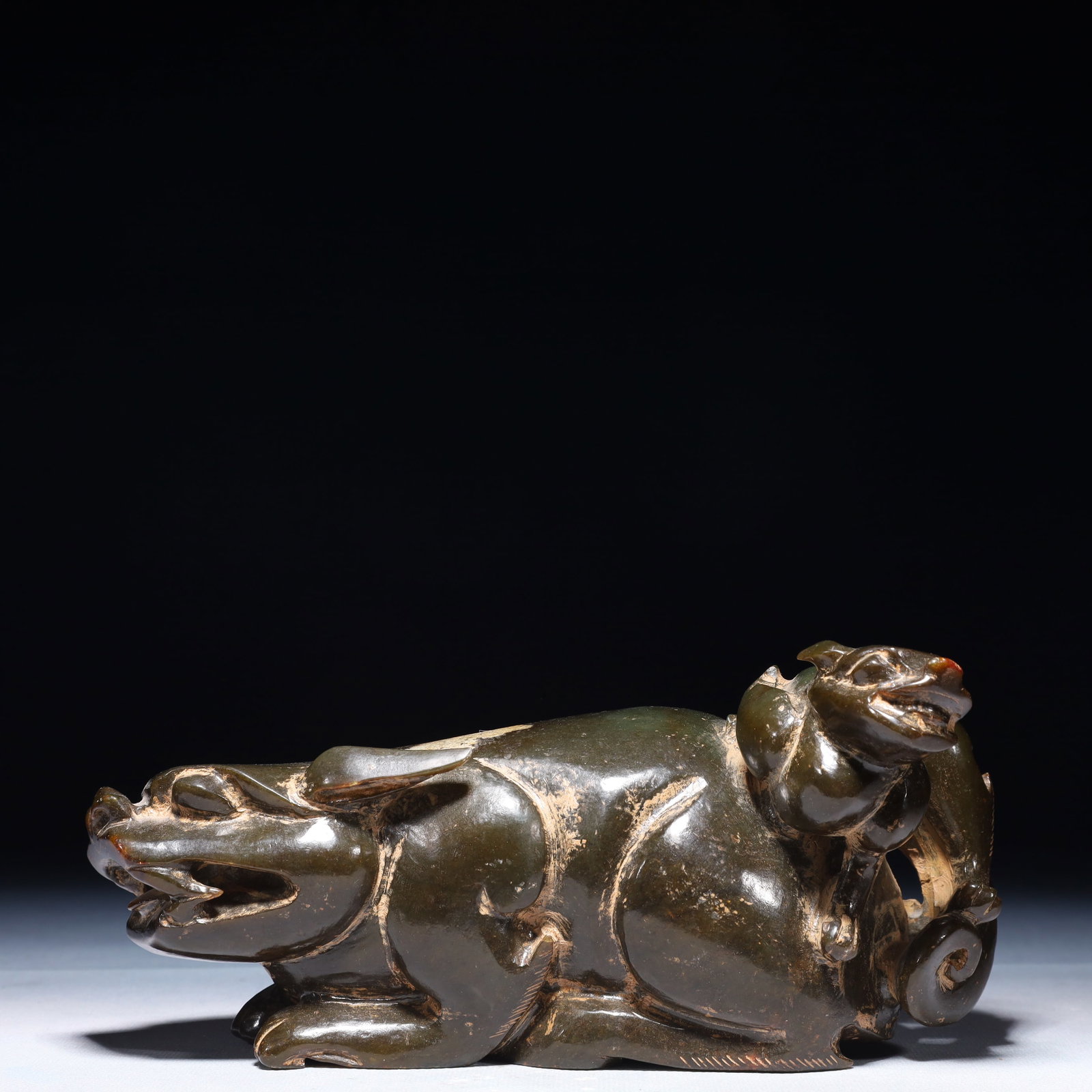 An Exquisite Green Jade Beast Ornament: An Exquisite Green Jade Beast Ornament,Qing Dynasty,China,Size:7.9inx3.1inx3.9in,Weight:2600g 青玉兽摆件,中国清代