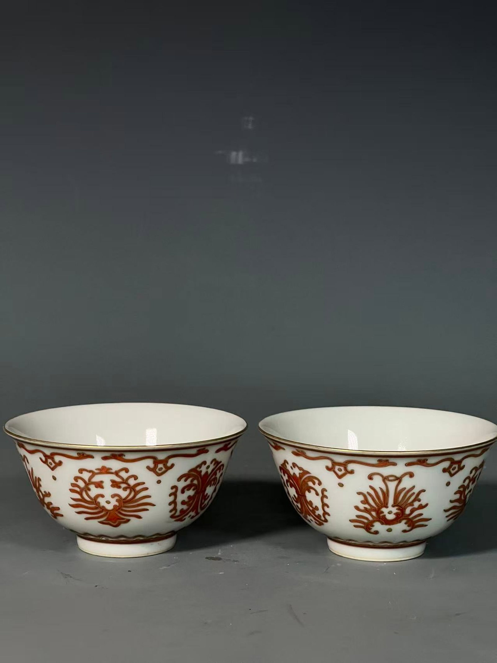 A Pair of Exquisite Iron-Red Painted Gold Eight Treasures Pattern Bowls: A Pair of Exquisite Iron-Red Painted Gold Eight Treasures Pattern Bowls,Qing Dynasty,China,Qianlong Six-character Mark,Size:2.2inx4.2in