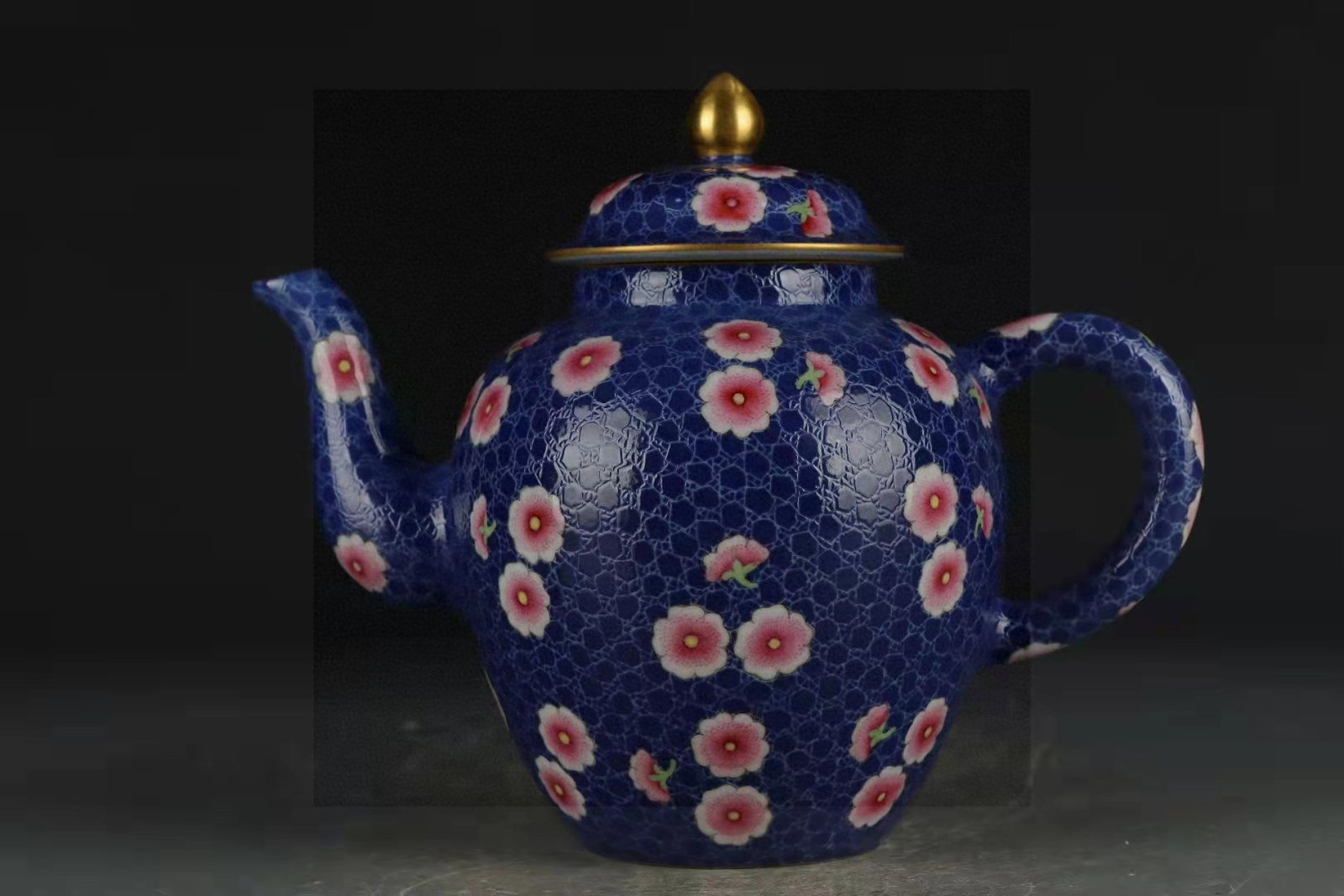 An Exquisite Blue Ground Famille-Rose Painted Gold Flower Pattern Teapot: An Exquisite Blue Ground Famille-Rose Painted Gold Flower Pattern Teapot,Qing Dynasty,China,Qianlong Six-character Mark,Size:6.5inx4.6in 蓝地粉彩描金花卉
