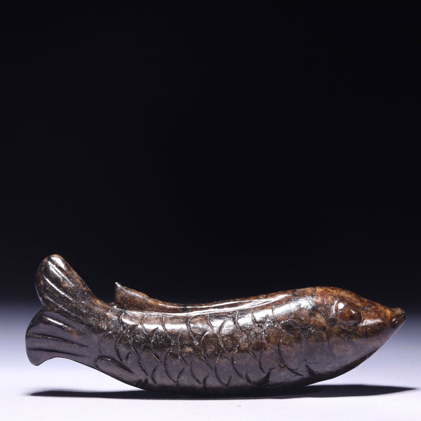 An Exquisite Archaic Jade Fish Ornament: An Exquisite Archaic Jade Fish Ornament,Ancient Time,China,Size:5.1inx1inx1.6in,Weight:228g 高古玉鱼摆件,中国远古时期