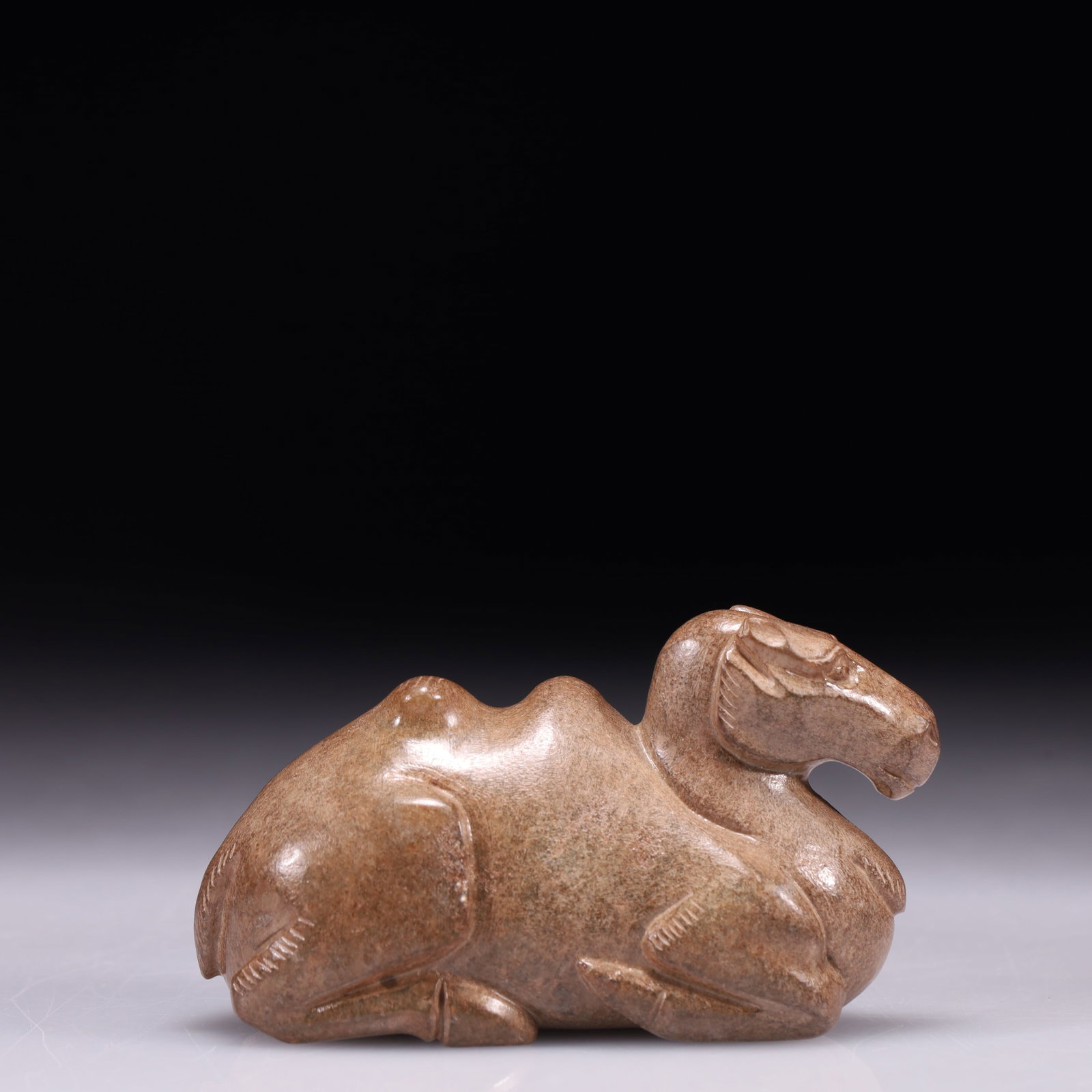 An Exquisite Archaic Jade Camel Ornament: An Exquisite Archaic Jade Camel Ornament,Ancient Time,China,Size:3inx1.2inx1.8in,Weight:175g 高古玉骆驼摆件,中国远古时期