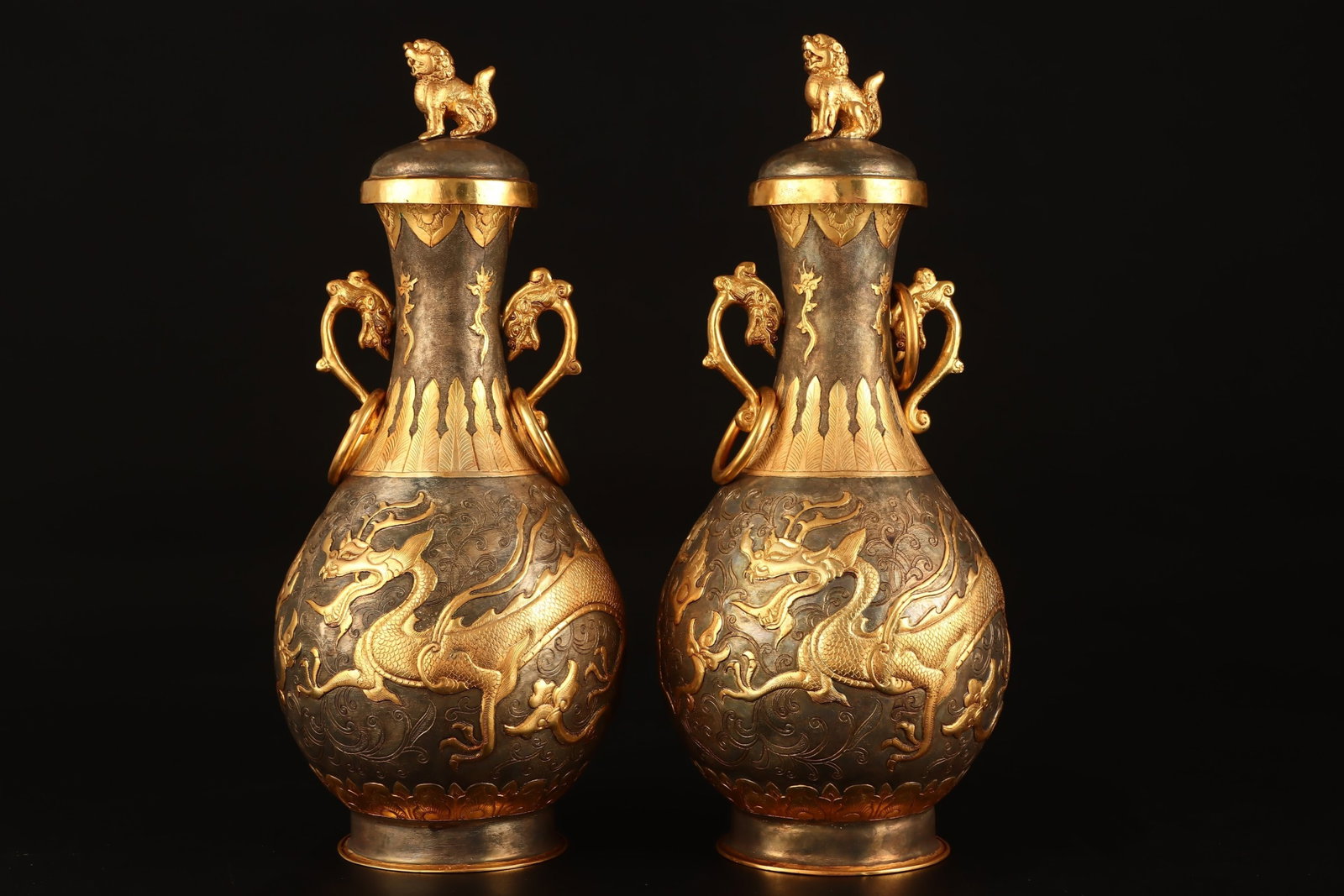 A Pair of Exquisite Gilt Auspicious Cloud and Dragon Pattern Double-Ears Bottles: A Pair of Exquisite Gilt Auspicious Cloud and Dragon Pattern Double-Ears Bottles,Tang Dynasty,China,With Mark,Size:11.8inx4.7in,Weight:2363g 一对鎏金祥云龙