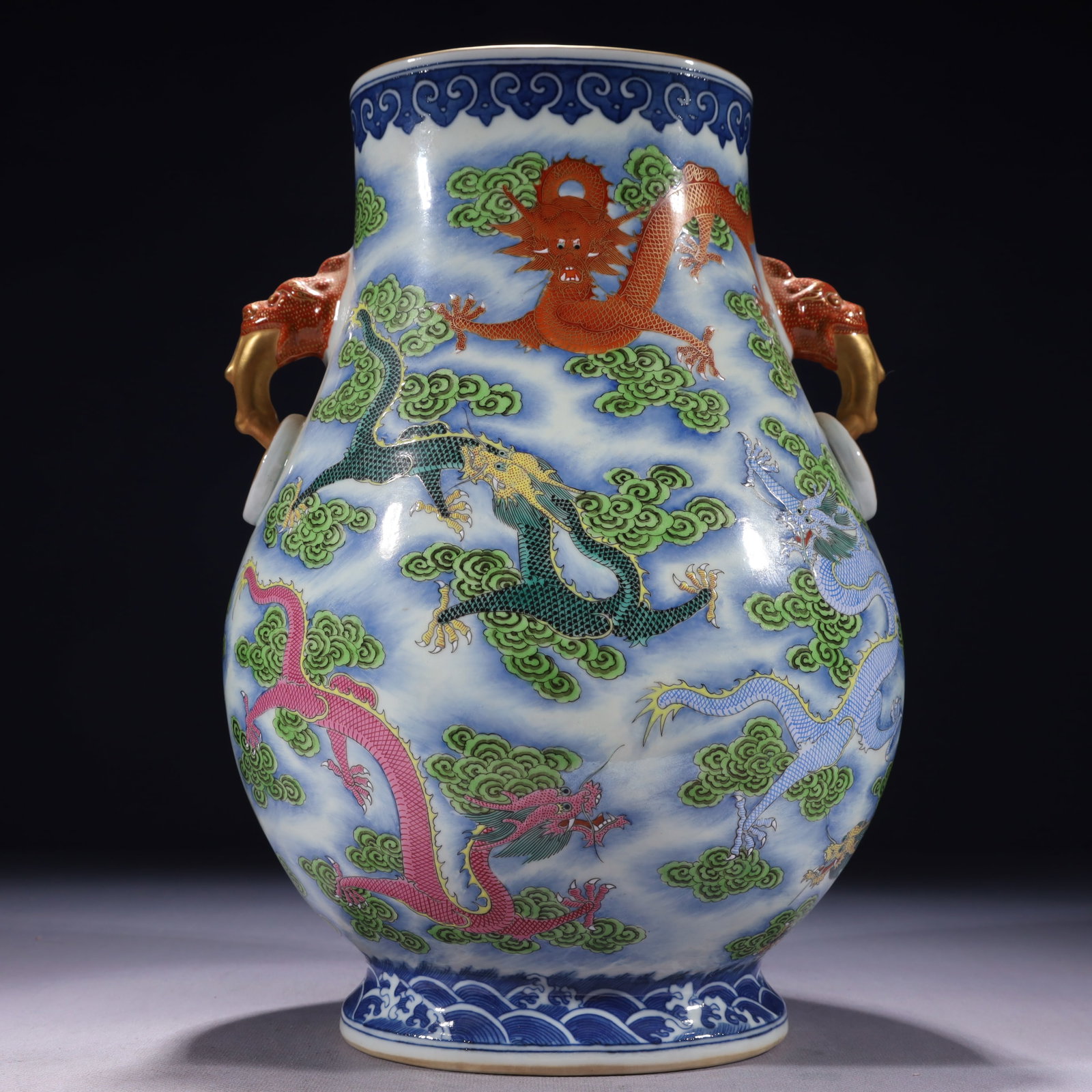 An Exquisite Famille-Rose Wucai Painted Gold Auspicious Cloud and Dragon Pattern Double-Ears Vase: An Exquisite Famille-Rose Wucai Painted Gold Auspicious Cloud and Dragon Pattern Double-Ears Vase,Qing Dynasty,China,Qianlong Six-character Mark,Size:8.3inx5.9inx13in,Weight:3650g 粉彩