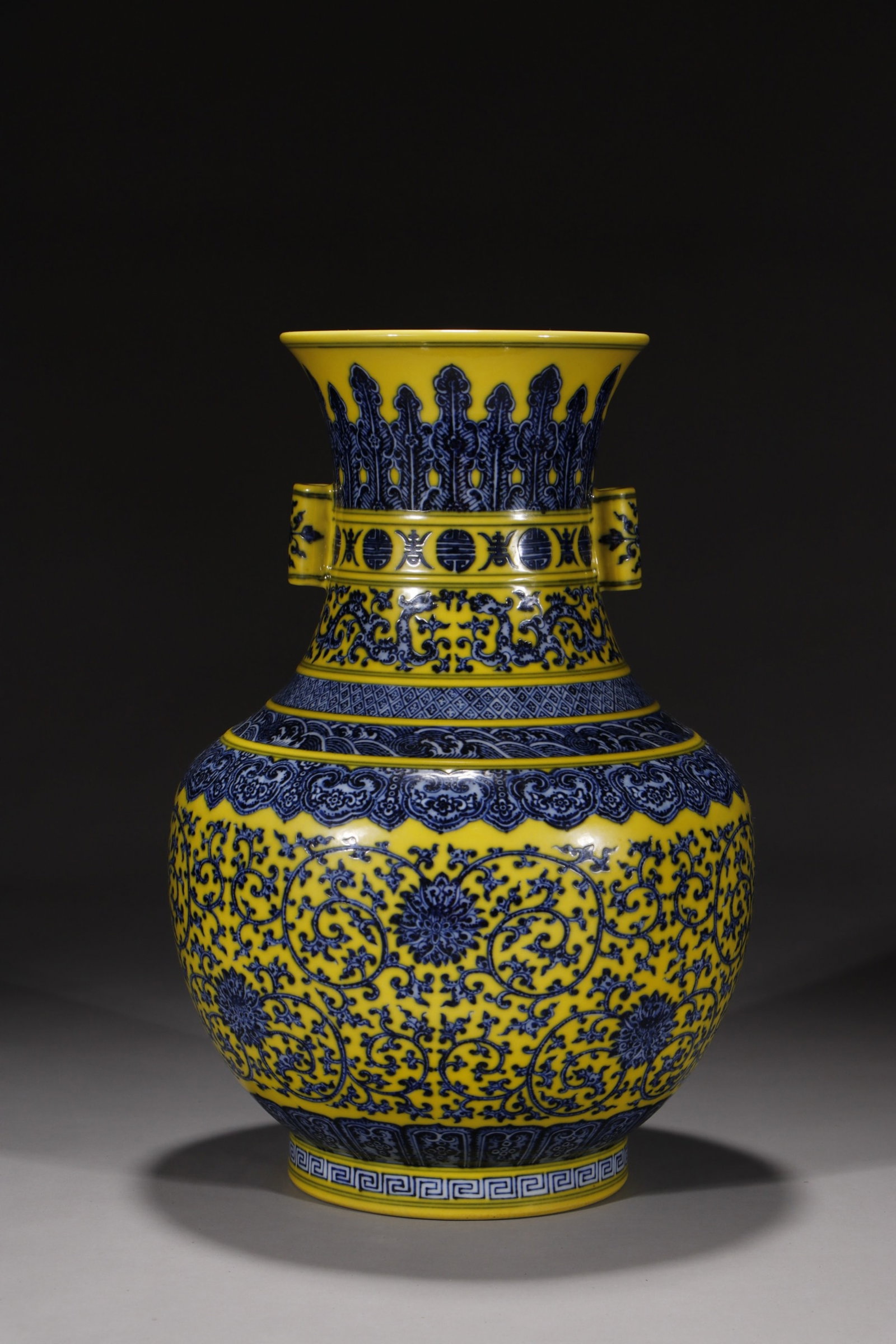 A Rare Yellow Ground Blue and White Lotus Pattern Double-Ears Vase: A Rare Yellow Ground Blue and White Lotus Pattern Double-Ears Vase,Qing Dynasty,China,Qianlong Six-character Mark,Size:14.6in 黄地青花缠枝莲纹双&#