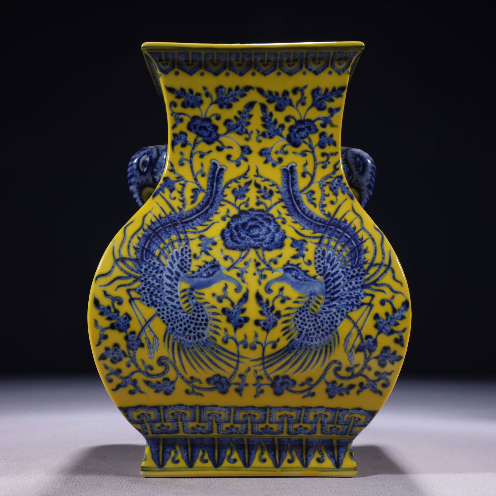 An Exquisite Yellow Ground Blue and White Flower and Phoenix Pattern Beast-Ears Vase: An Exquisite Yellow Ground Blue and White Flower and Phoenix Pattern Beast-Ears Vase,Qing Dynasty,China,Qianlong Six-character Mark,Size:7.5inx5.5inx11in,Weight:3100g 黄地青花&
