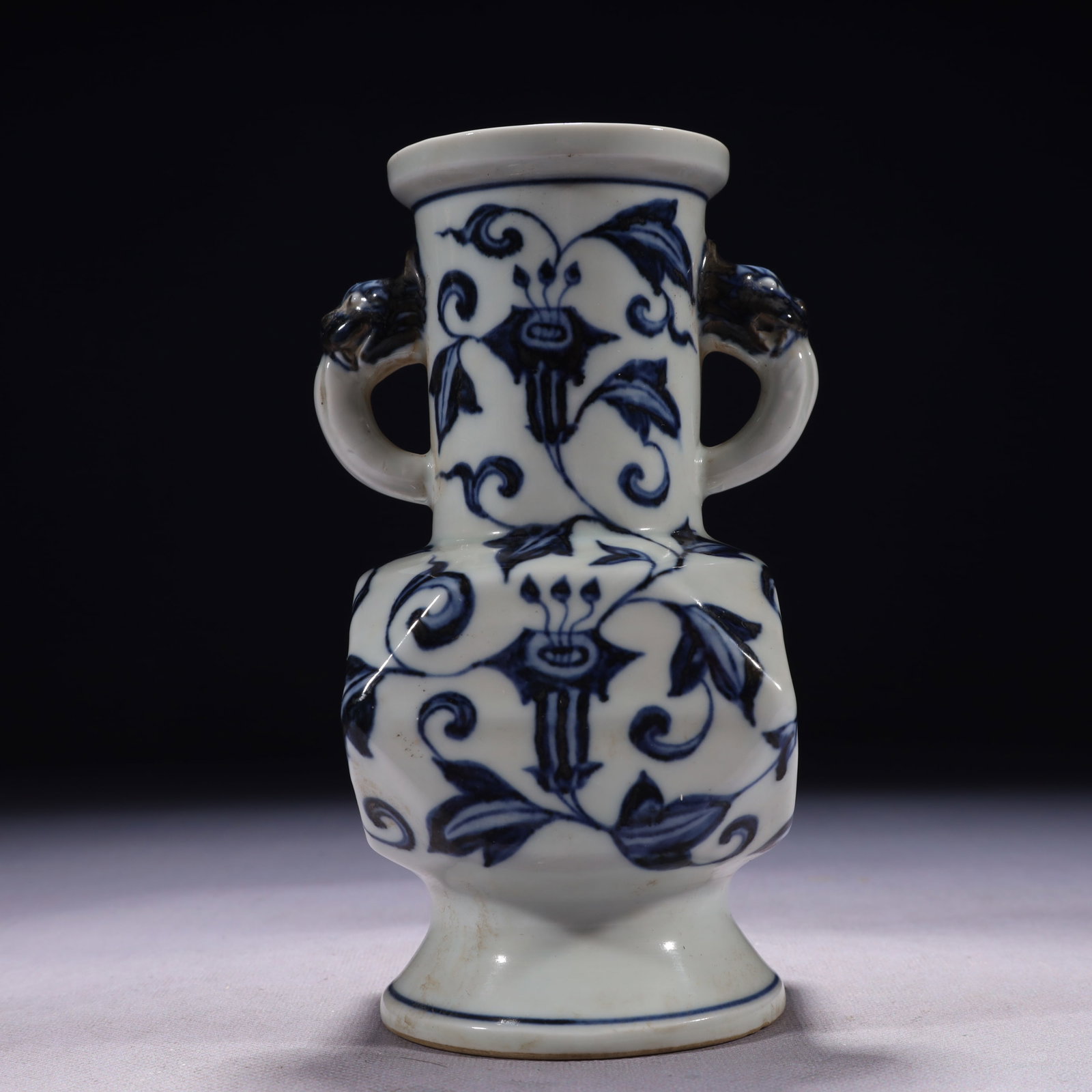 An Exquisite Blue and White Flower Pattern Double-Ears Vase: An Exquisite Blue and White Flower Pattern Double-Ears Vase,Ming Dynasty,China,Xuande Six-character Mark,Size:3.5inx7.1in,Weight:850g 青花花卉纹双耳瓶,&
