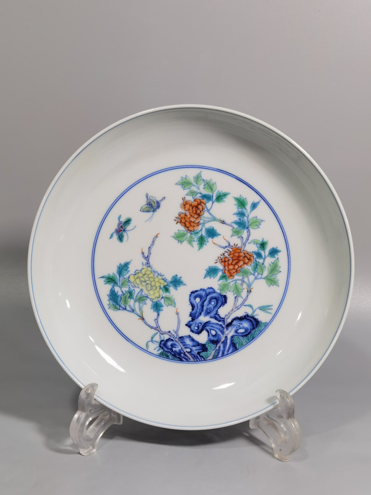 An Exquisite Blue and White Doucai Flower and Butterfly Pattern Plate: An Exquisite Blue and White Doucai Flower and Butterfly Pattern Plate,Qing Dynasty,China,Yongzheng Six-character Mark,Size:8.4inx1.8in