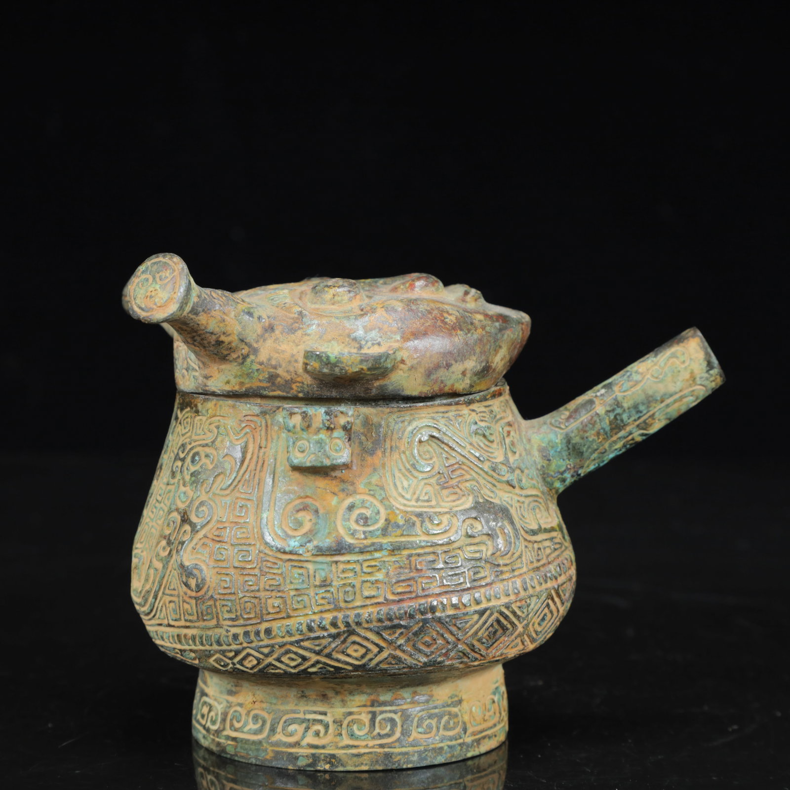 An Archaic Bronze Figure-Face Pattern Beast-Ears Pot: An Archaic Bronze Figure-Face Pattern Beast-Ears Pot,the Warring States Period in China,Size:4.7inx3.5inx4.3in,Weight:750g