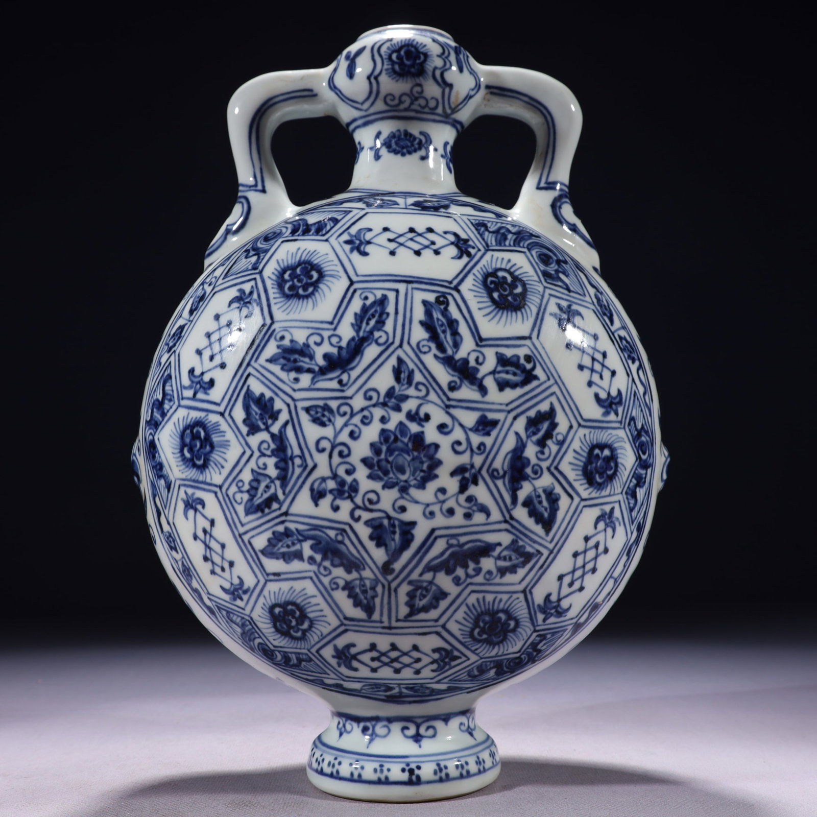 An Exquisite Blue and White Lotus Pattern Double-Ears Vase: An Exquisite Blue and White Lotus Pattern Double-Ears Vase,Ming Dynasty,China,Size:7.9inx4.7inx11.8in,Weight:2100g 青花缠枝莲纹双耳瓶,中