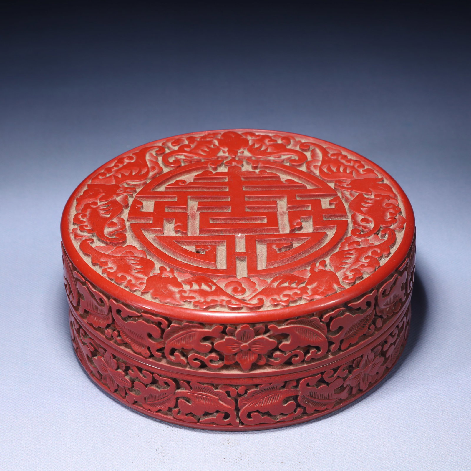 An Exquisite Carved Red Lacquer Shou-Character Pattern Box with Cover: An Exquisite Carved Red Lacquer Shou-Character Pattern Box with Cover,Qing Dynasty,China,Qianlong Four-character Mark,Size:6.9inx2.8in,Weight:650g