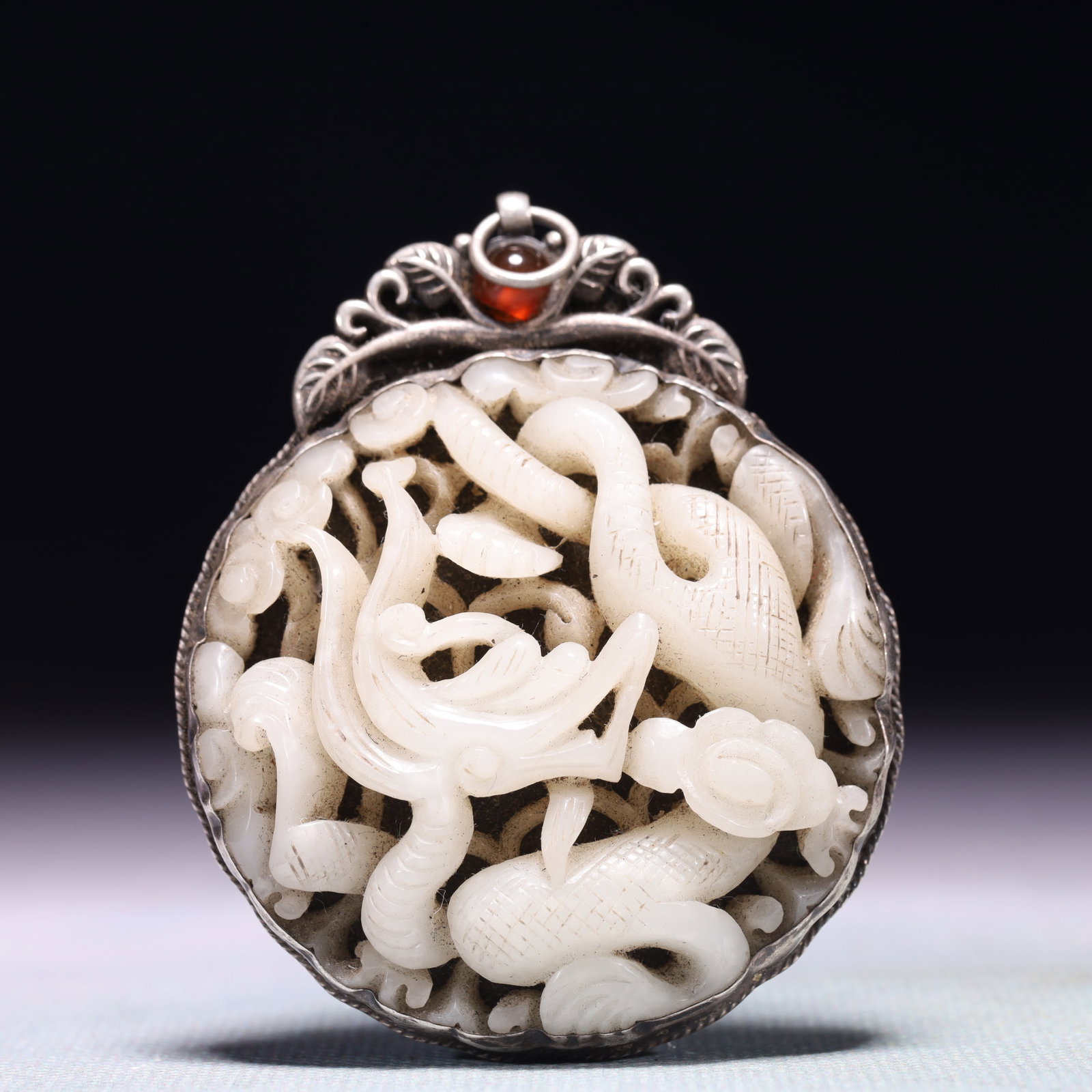 An Exquisite Silver Inlaid White Jade Auspicious Cloud and Dragon Pattern Pendant: An Exquisite Silver Inlaid White Jade Auspicious Cloud and Dragon Pattern Pendant,Qing Dynasty,China,Size:2.2inx2.6in,Weight:44.5g