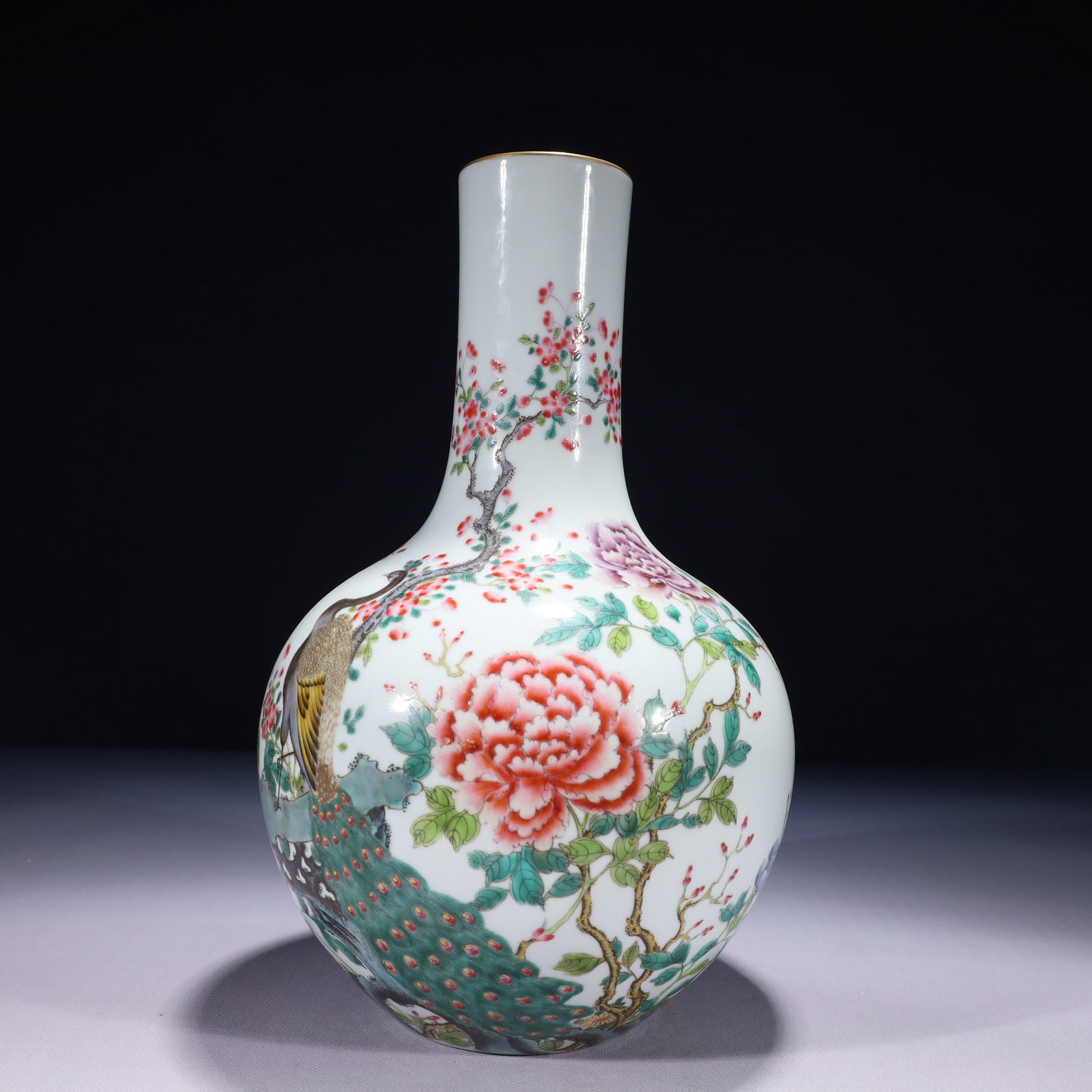 An Exquisite Famille-Rose Painted Gold Flower and Peacock Pattern Vase: An Exquisite Famille-Rose Painted Gold Flower and Peacock Pattern Vase,Qing Dynasty,China,Qianlong Six-character Mark,Size:7.5inx13.8in,Weight:2100g