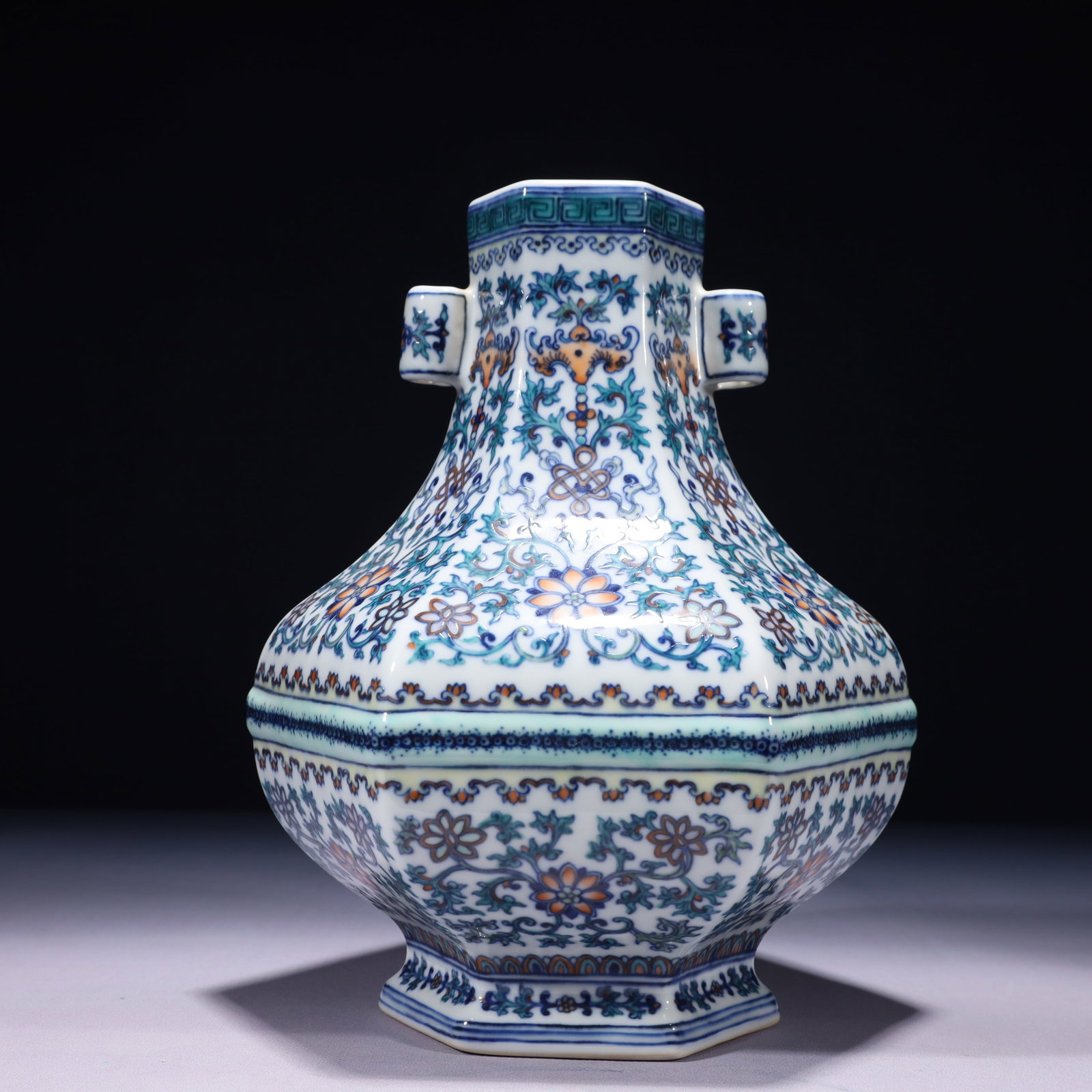 An Exquisite Blue and White Doucai Lotus Pattern Double-Ears Vase: An Exquisite Blue and White Doucai Lotus Pattern Double-Ears Vase,Qing Dynasty,China,Qianlong Six-character Mark,Size:7.9inx10.6in,Weight:2950g